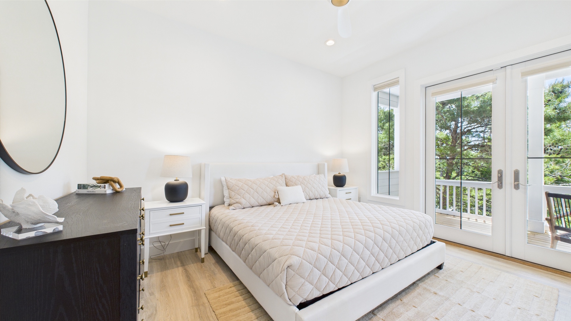 Master bedroom with king bed TV and ensuite bathroom