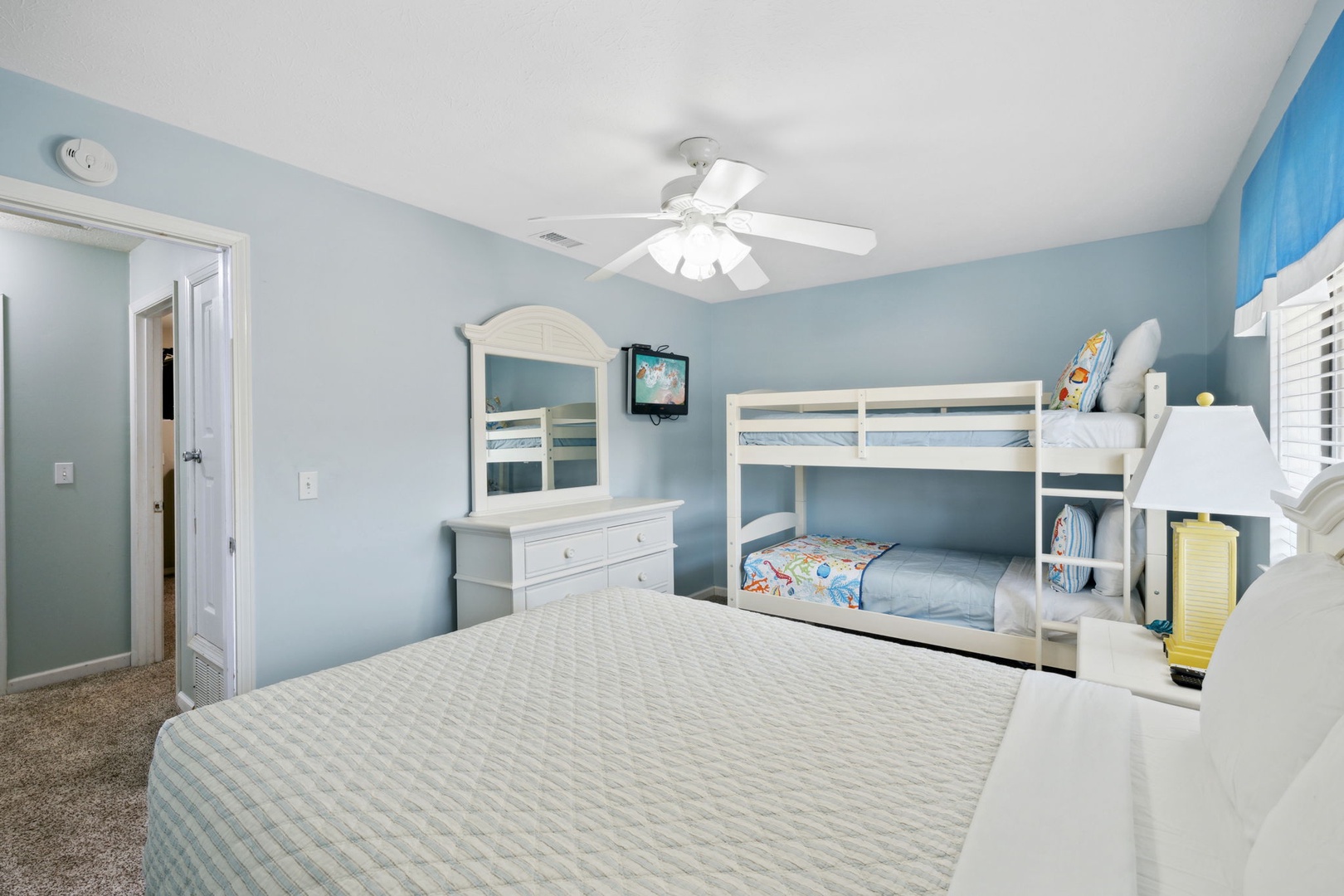 Bedroom with twin bunkbeds and double bed