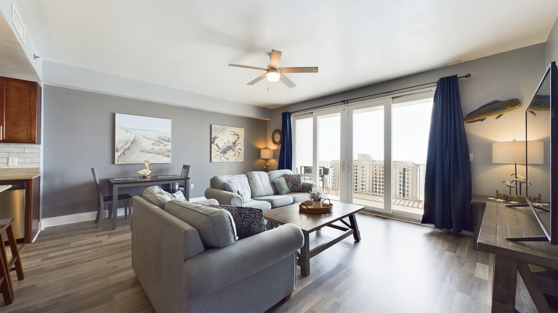 Open concept living area with TV coastal views and sleeper sofa
