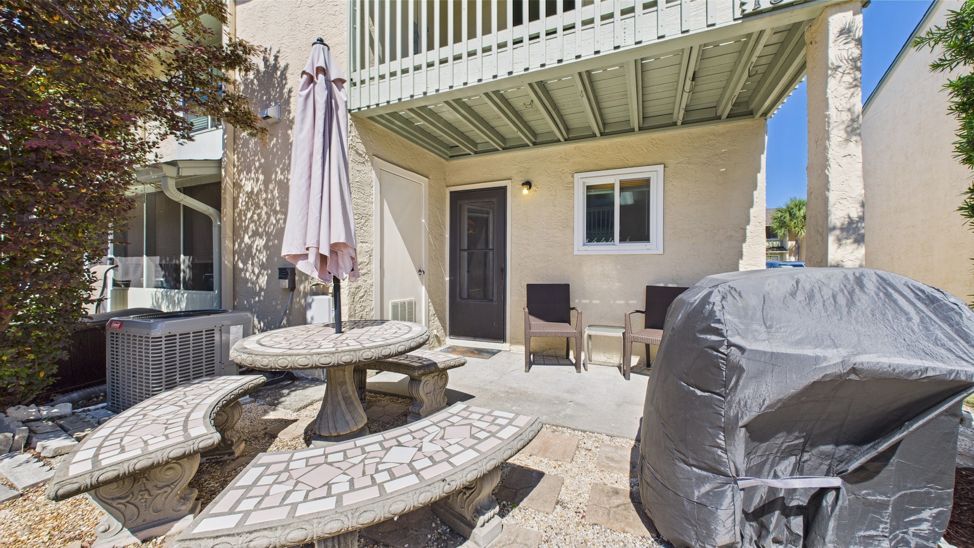 Grill and dining area in backyard