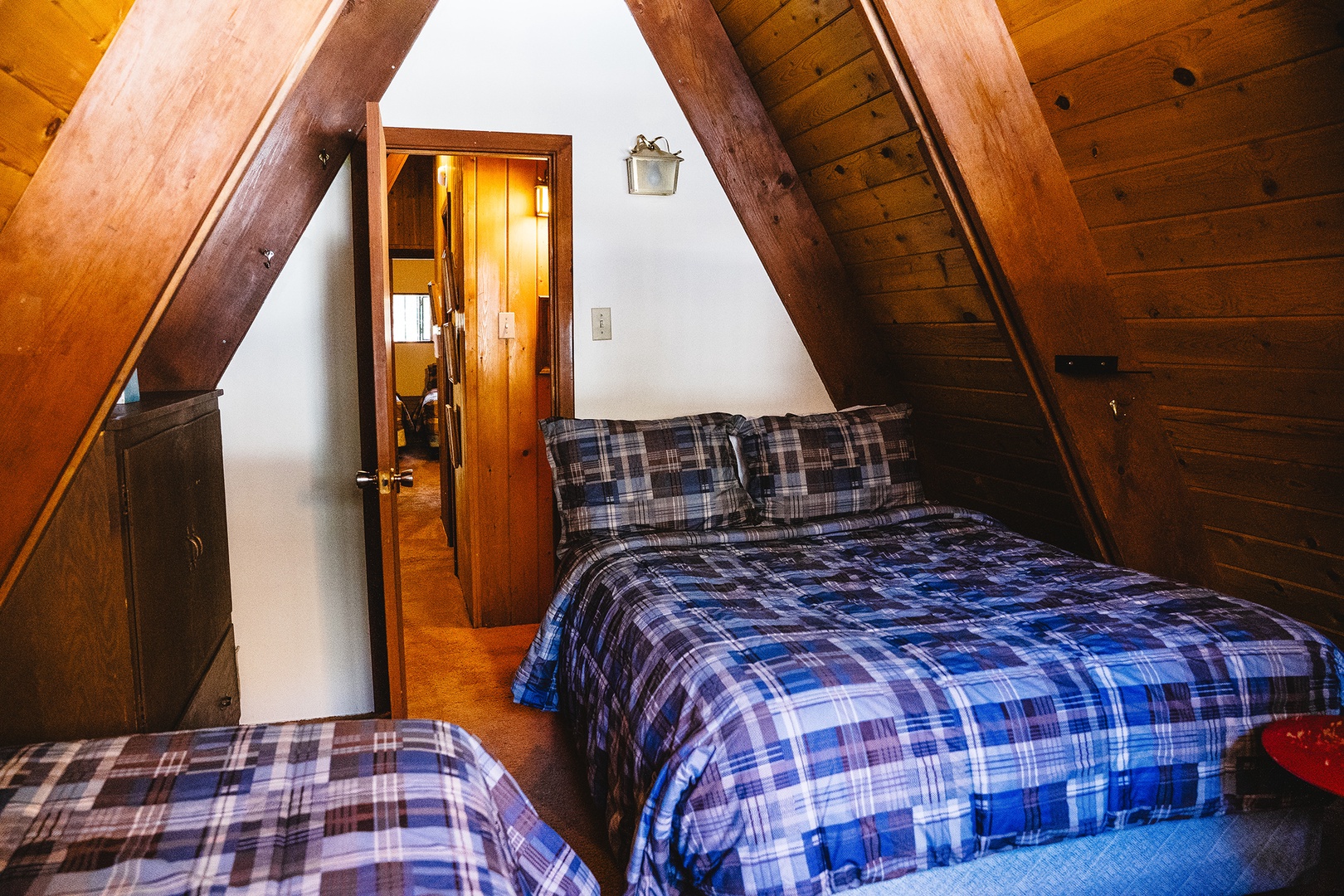 Upstairs bedroom with two twins and a full bed