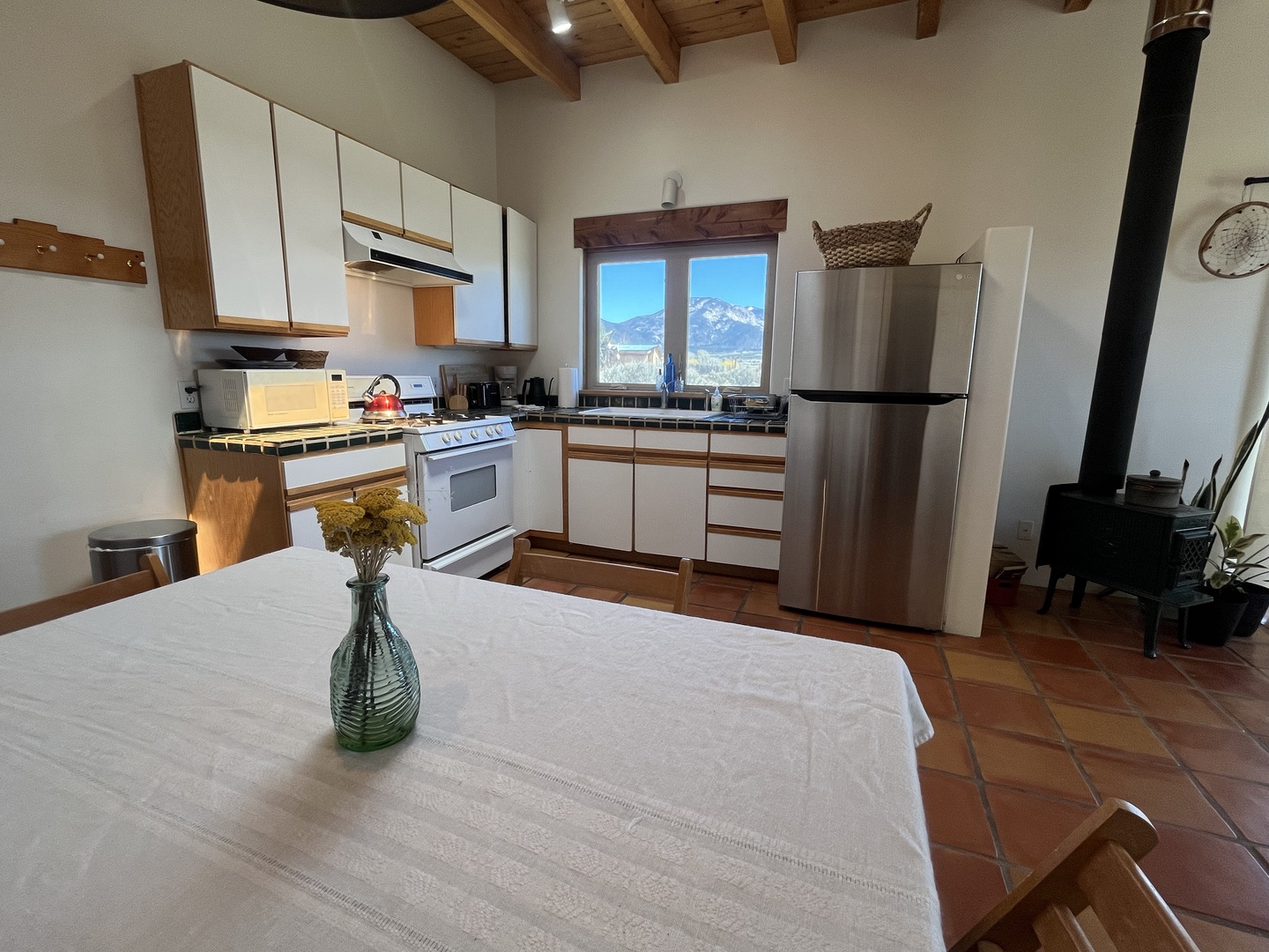 Cook your favorite meals in this fully-equipped kitchen while enjoying stunning mountain views through the picture window.