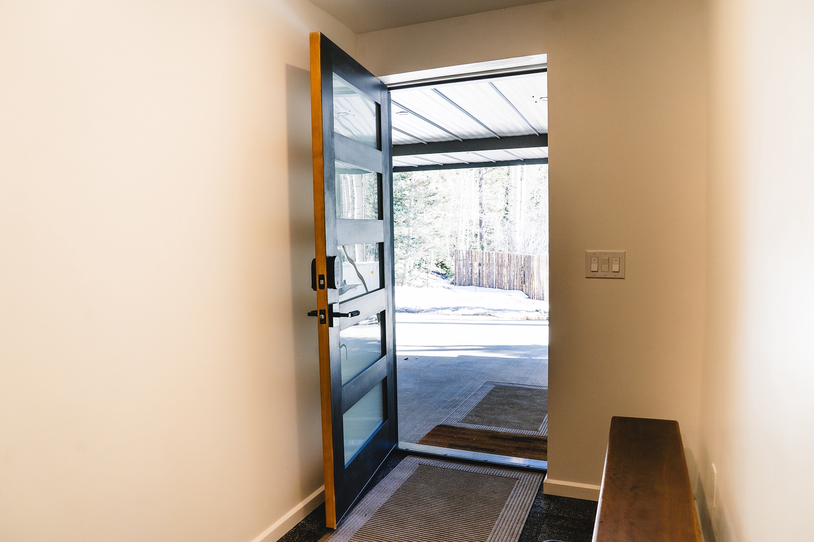 Private main entry for guests from driveway into the mud room area