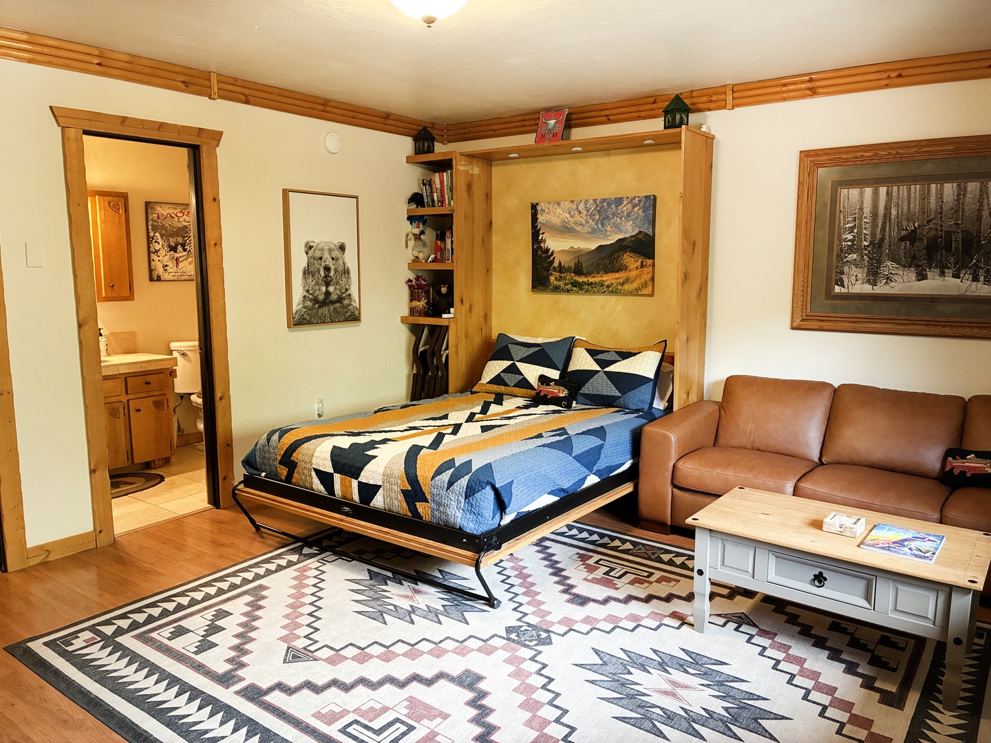 Comfortable queen murphy bed in the livingroom.