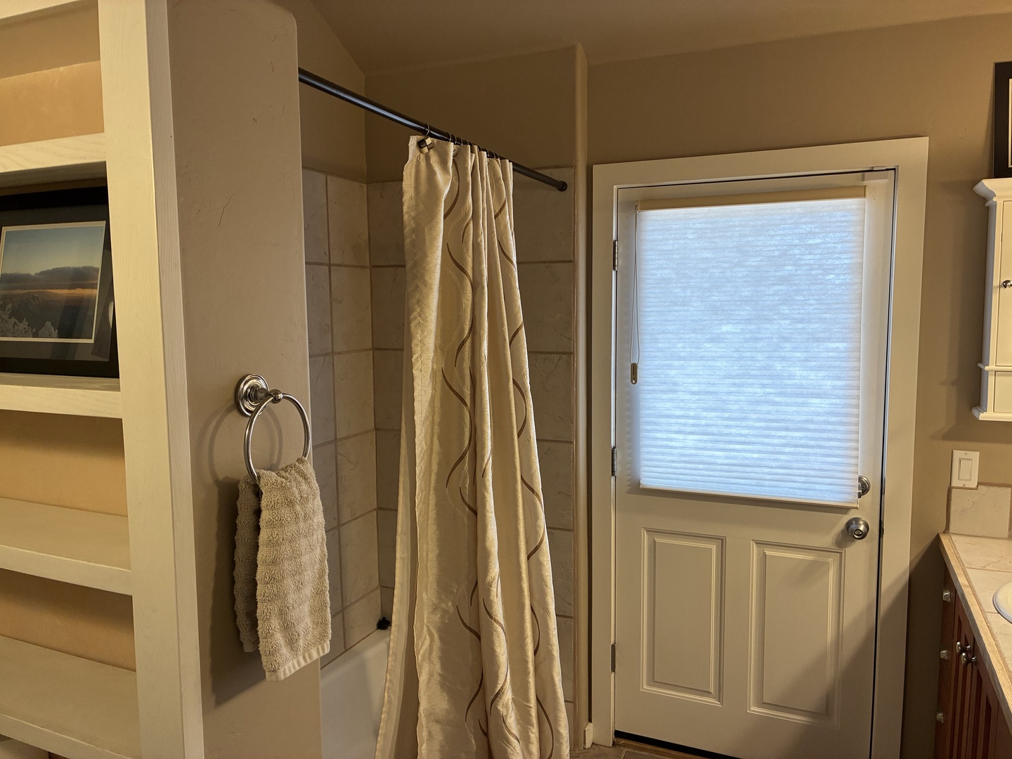 Step into your private oasis with a spacious walk-in shower, fresh towels at hand, and natural light filtering through—your perfect retreat after a day of adventure.