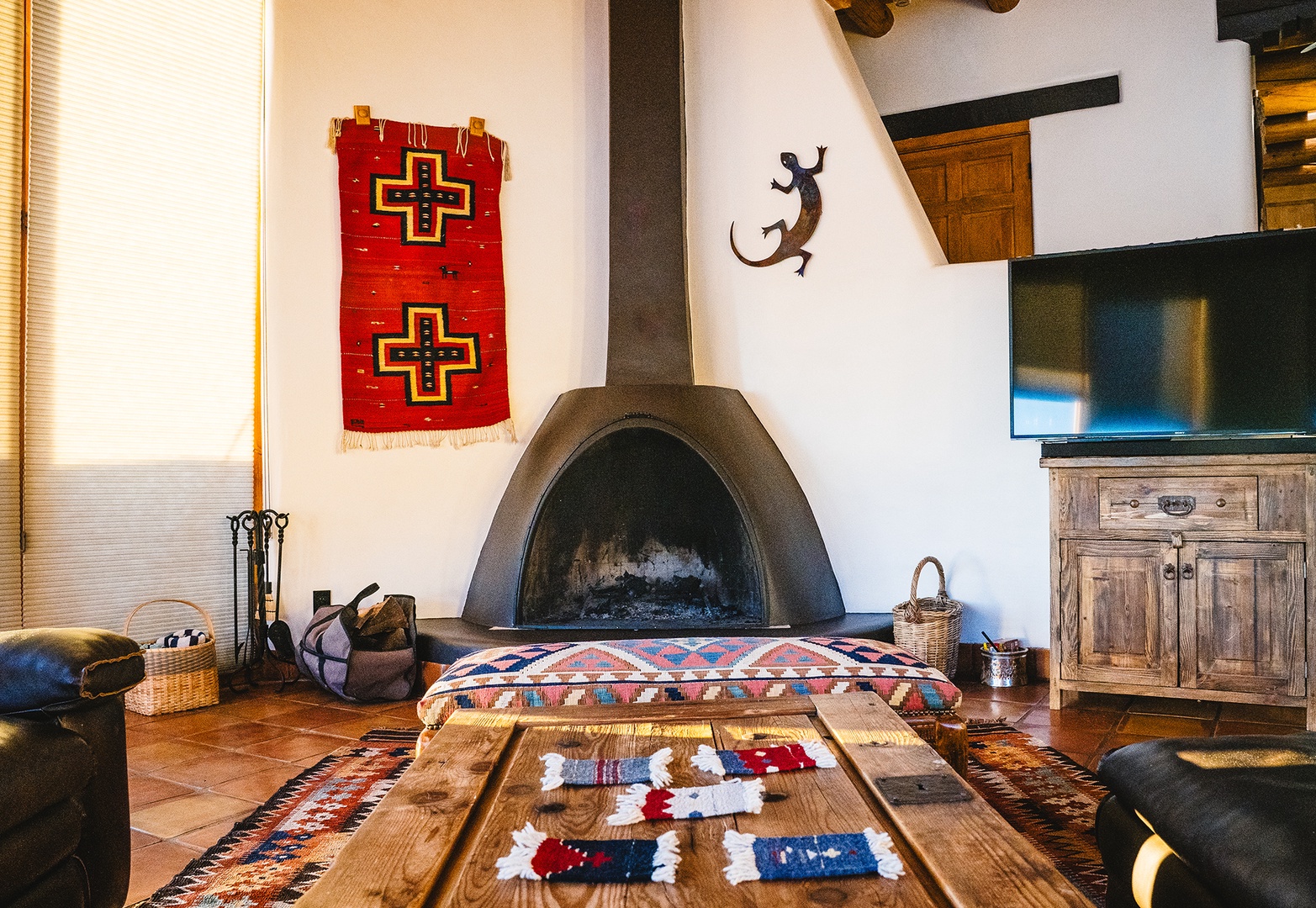 Cozy up in your rustic Southwest-style living room, where handcrafted furnishings and a traditional kiva fireplace create the perfect gathering space.