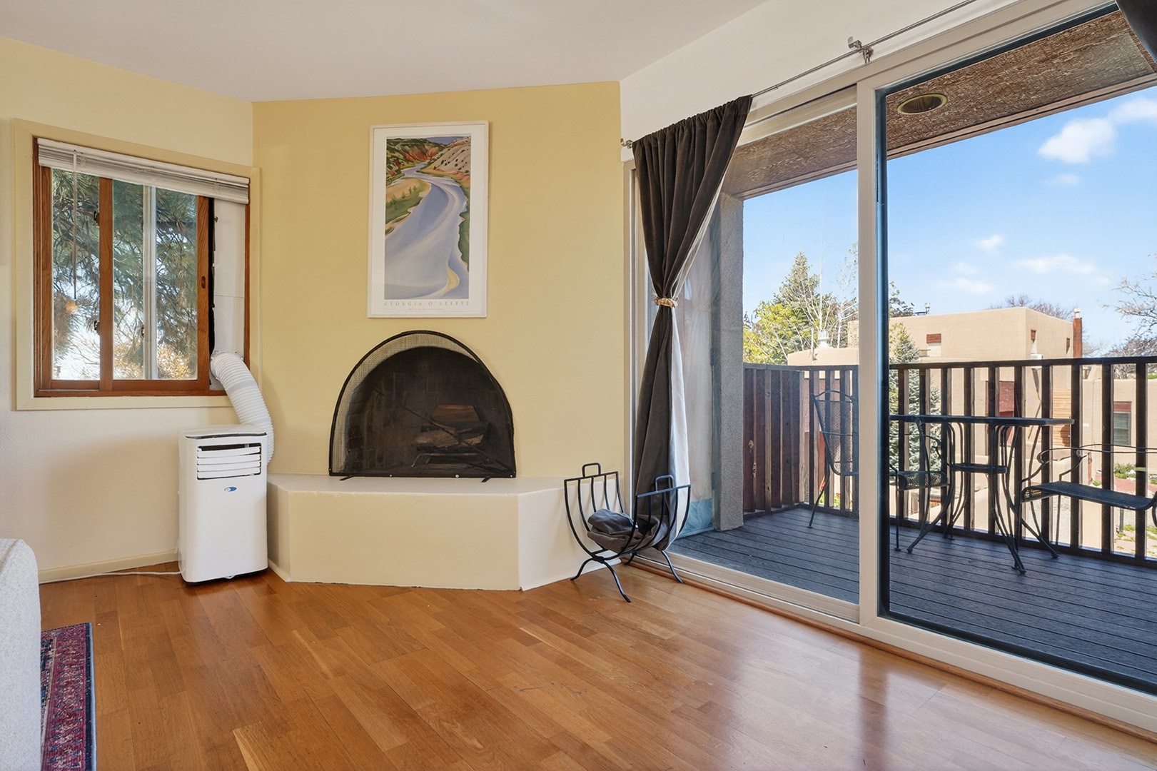 Fireplace close up and patio sliders with curtains