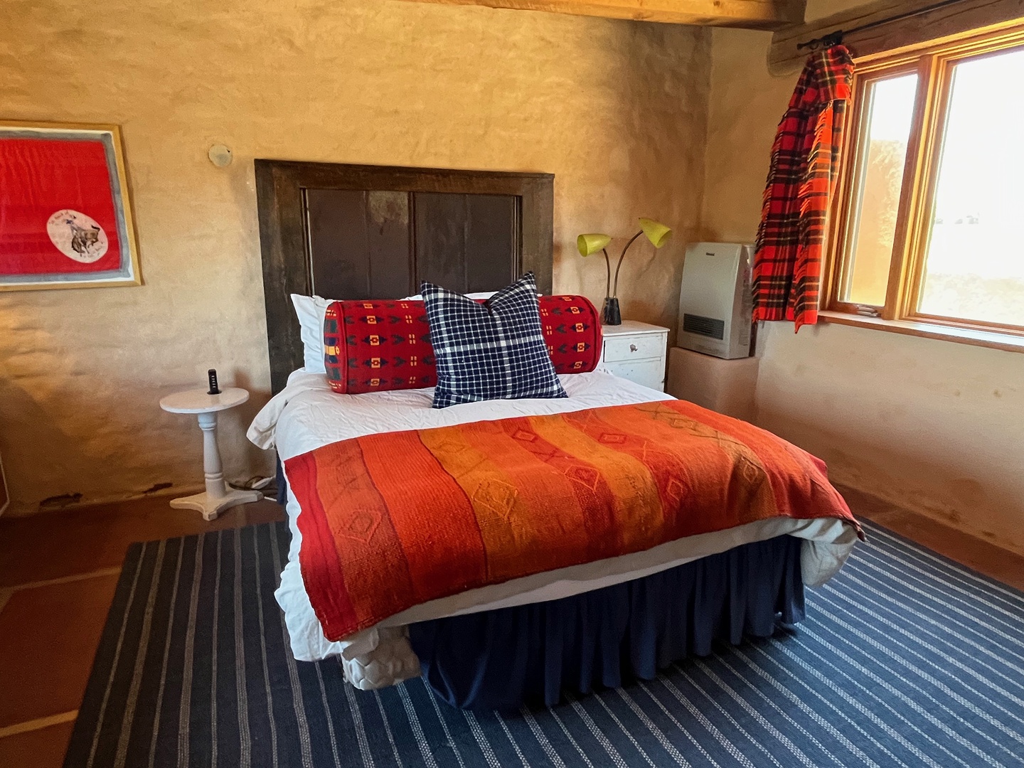 Your retreat awaits with plush bedding, charming rustic touches, and soft natural light streaming in.