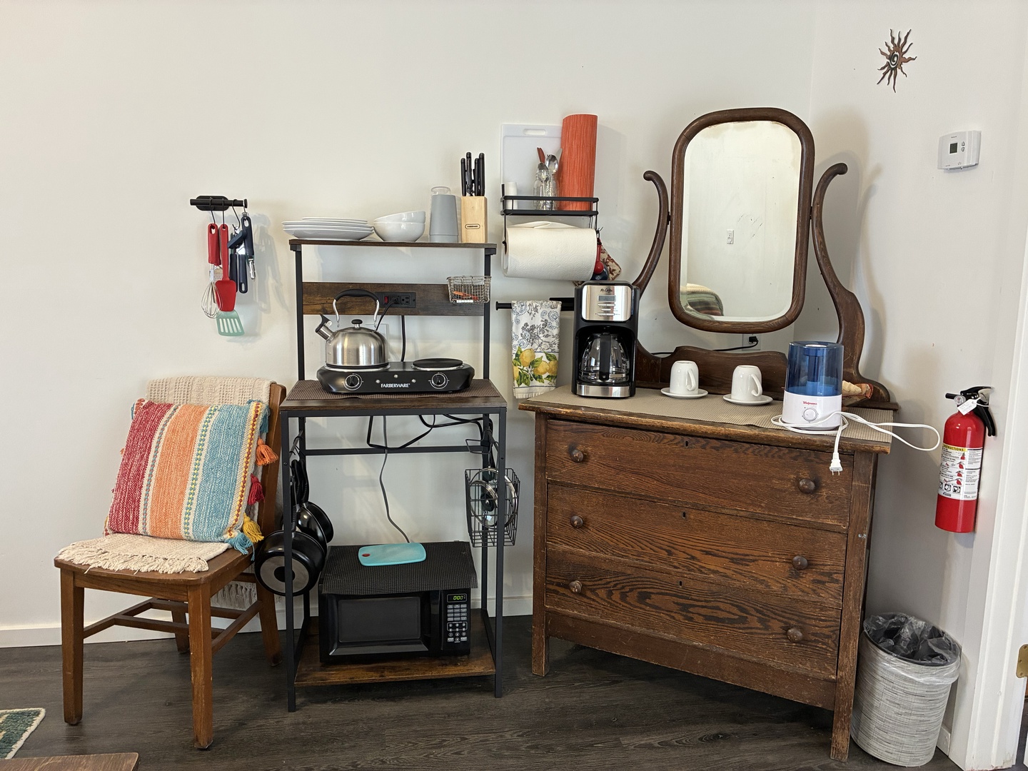 Your cozy kitchenette area features everything you need to feel at home, with a double burner, coffee maker, and vintage charm that adds character to your stay.