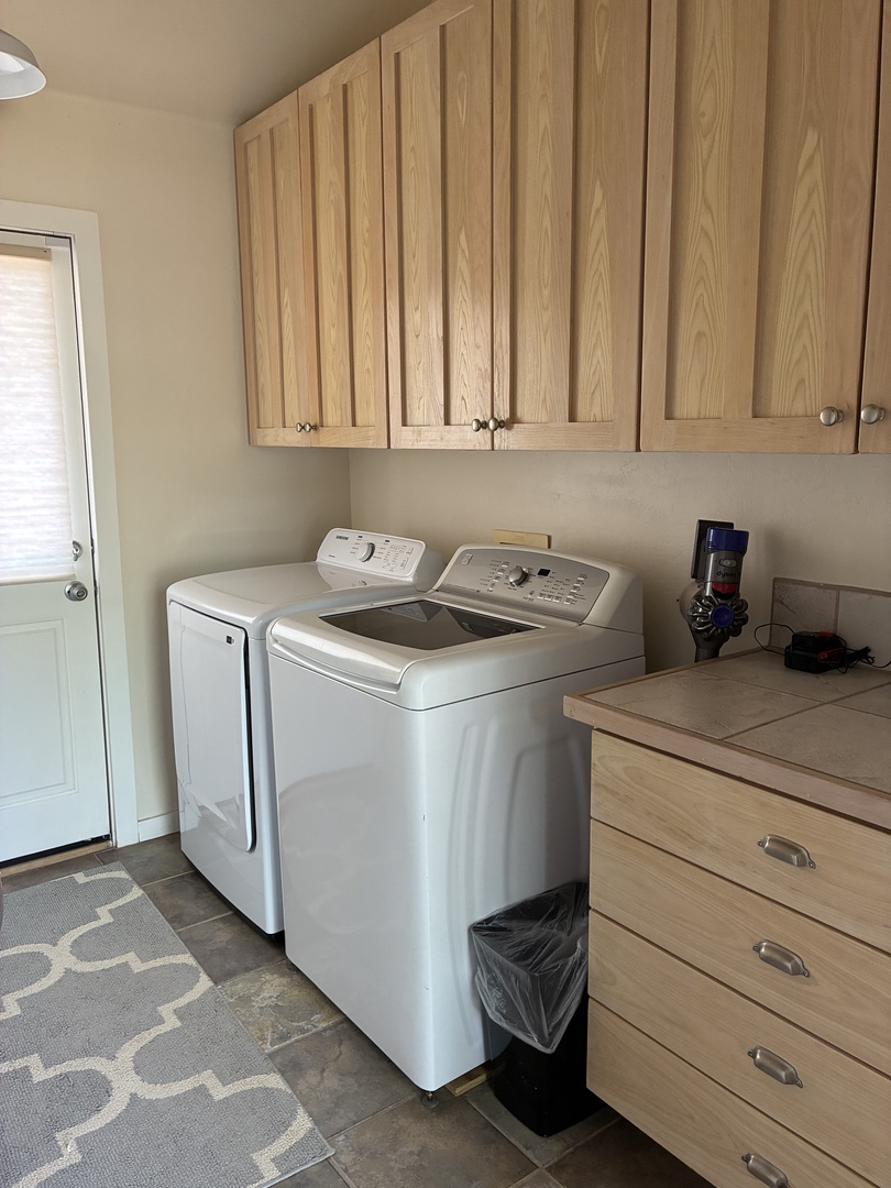 Your own dedicated laundry room with full-size washer and dryer, plus plenty of cabinet storage—one less thing to worry about during your getaway.