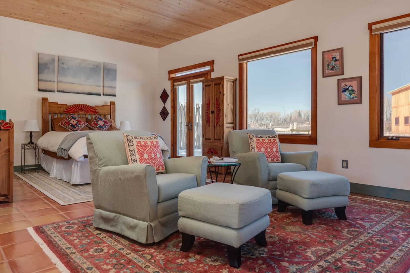 Sink into plush seating while natural light pours through wood-framed windows. Colorful textiles and southwestern touches create your own cozy retreat under warm pine ceilings.