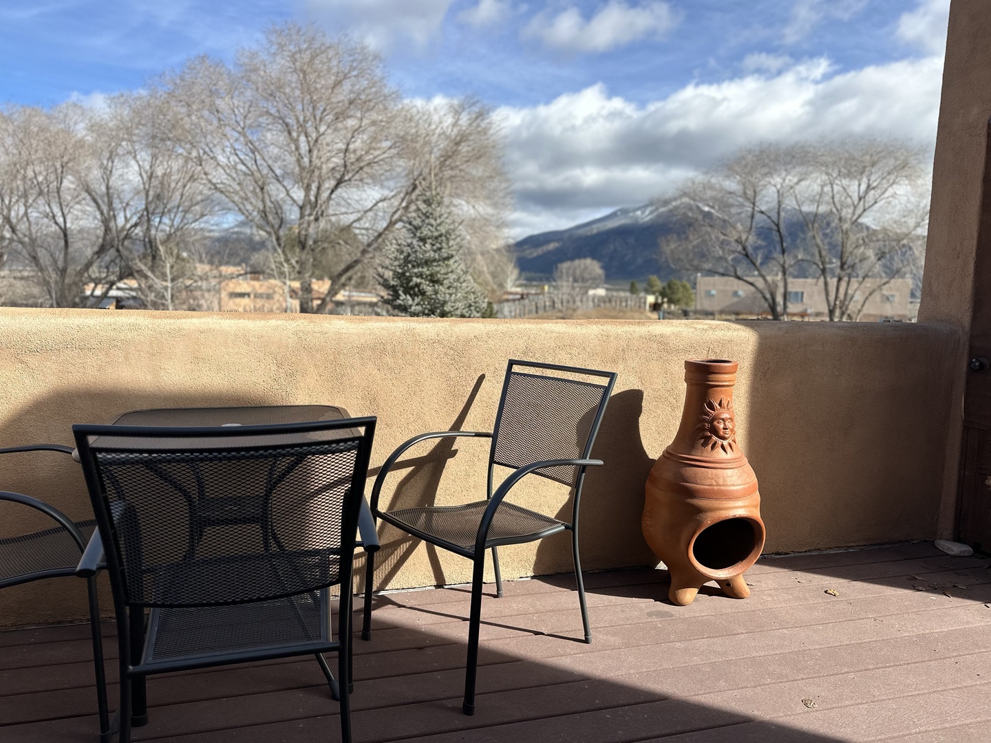 Relax on your private terrace with comfortable seating and stunning mountain views stretching across the horizon.