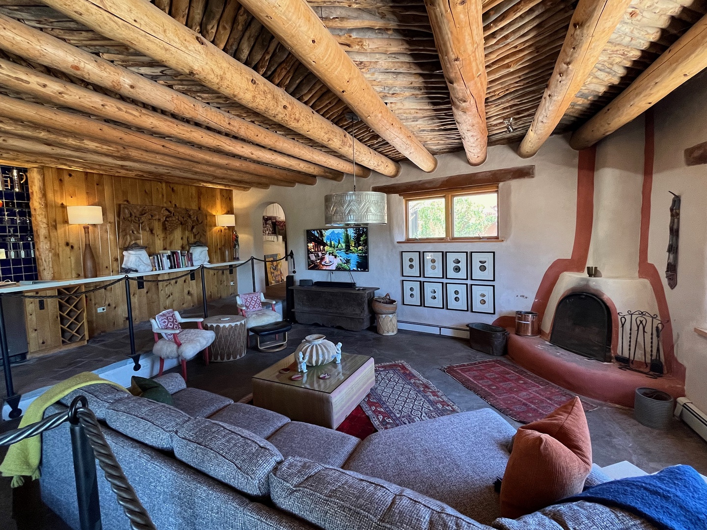 Gather under hand-hewn beams in your spacious living room, enjoy fireplace or TV to help you relax into this dreamy space.