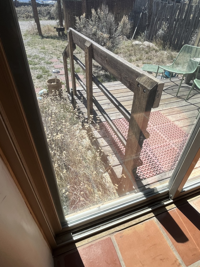 Step out onto your private deck where outdoor seating awaits among peaceful garden surroundings for morning coffee or evening relaxation.