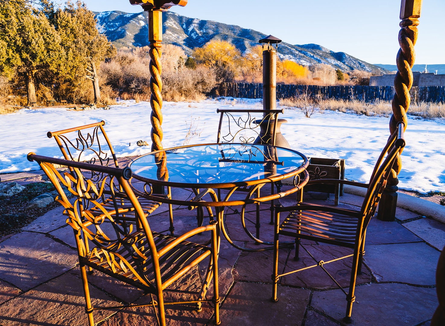 Peaceful patio seating with mountain views creates the perfect spot to enjoy morning coffee in the crisp winter air.