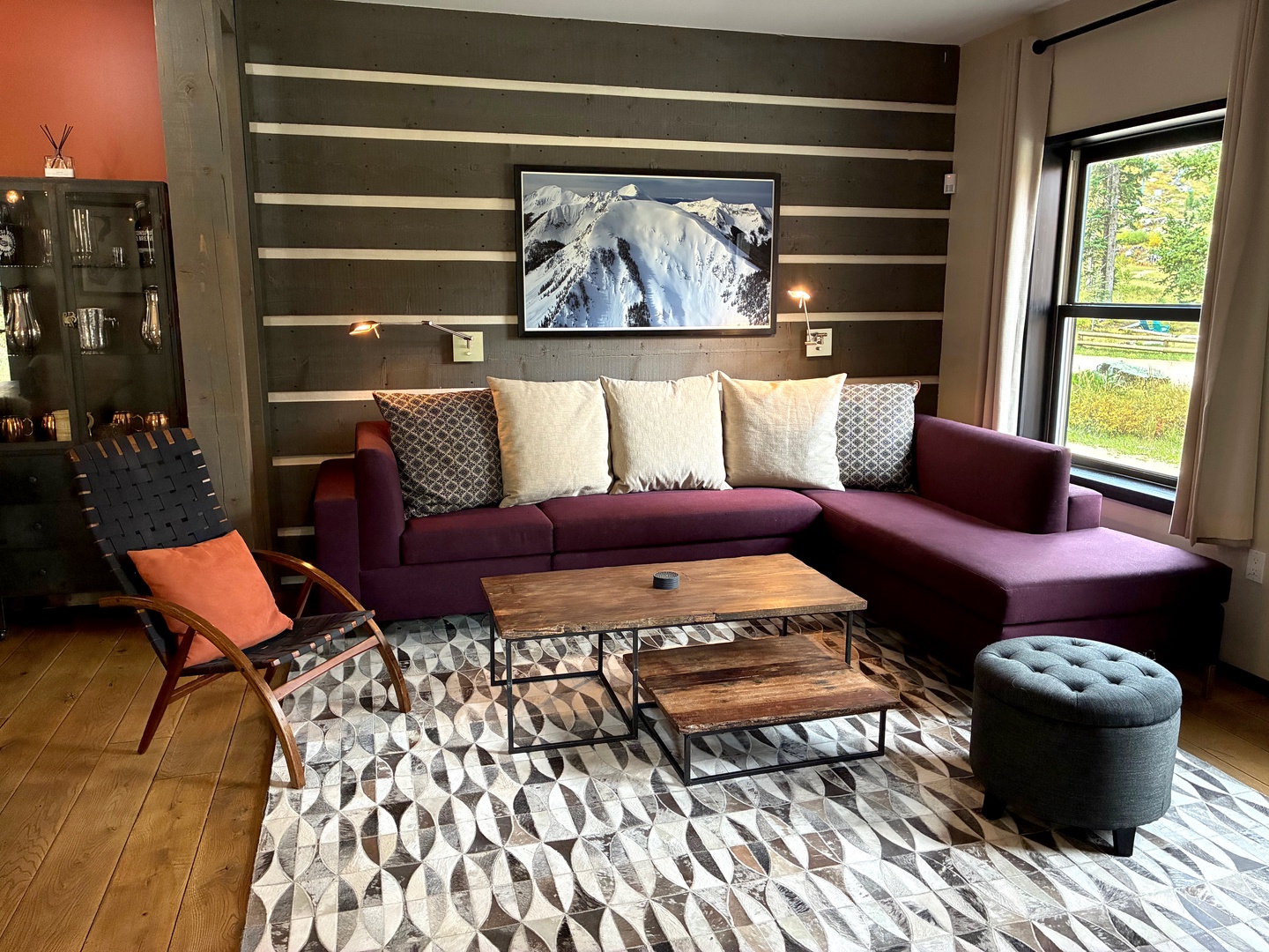 Sink into your plush sectional and let natural light fill this beautifully designed space, complete with thoughtful details and a cozy accent chair where you can unwind with your favorite drink.