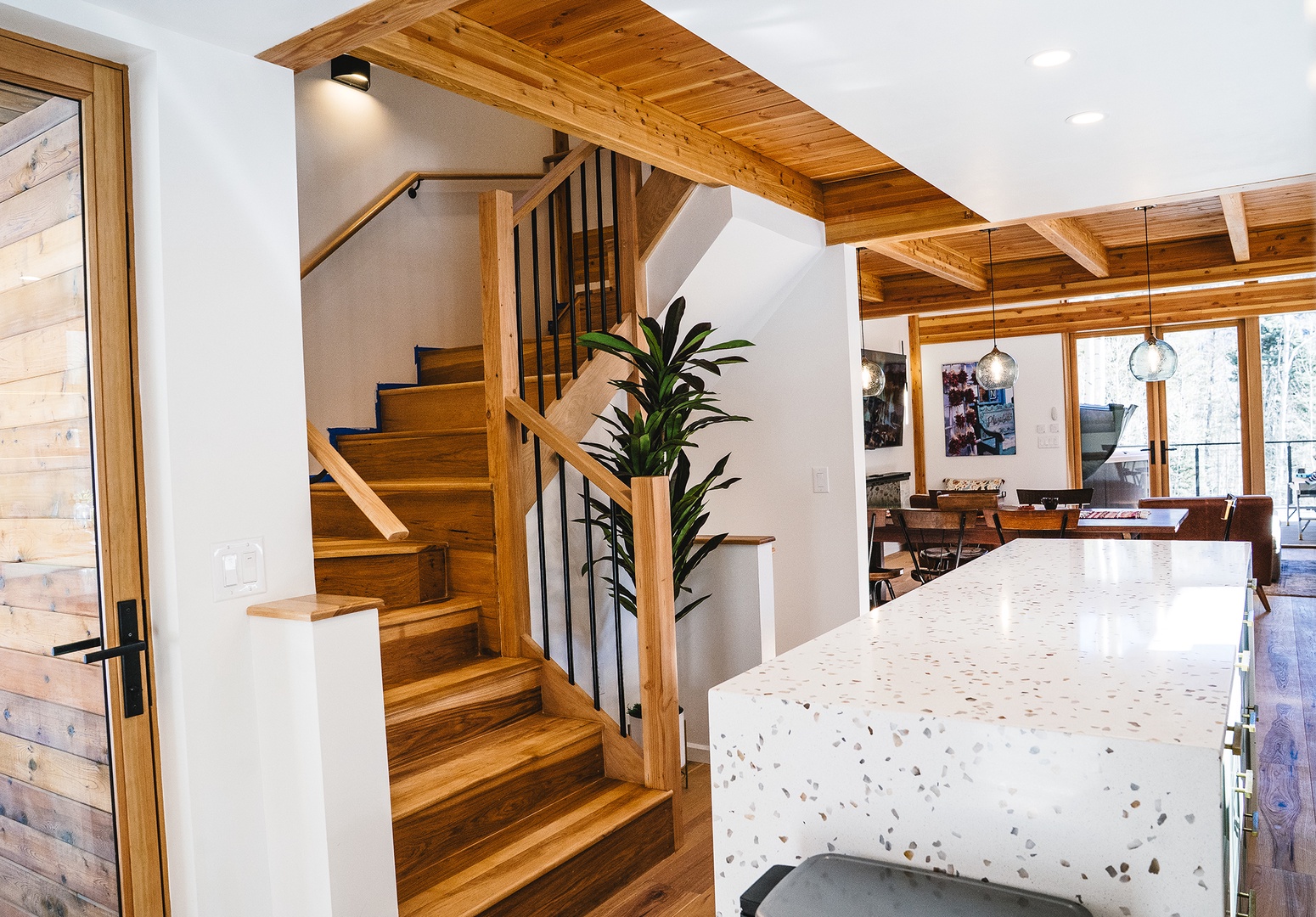 Relax in this stunning open-concept space where rustic wood beams meet modern elegance, creating your perfect mountain retreat.