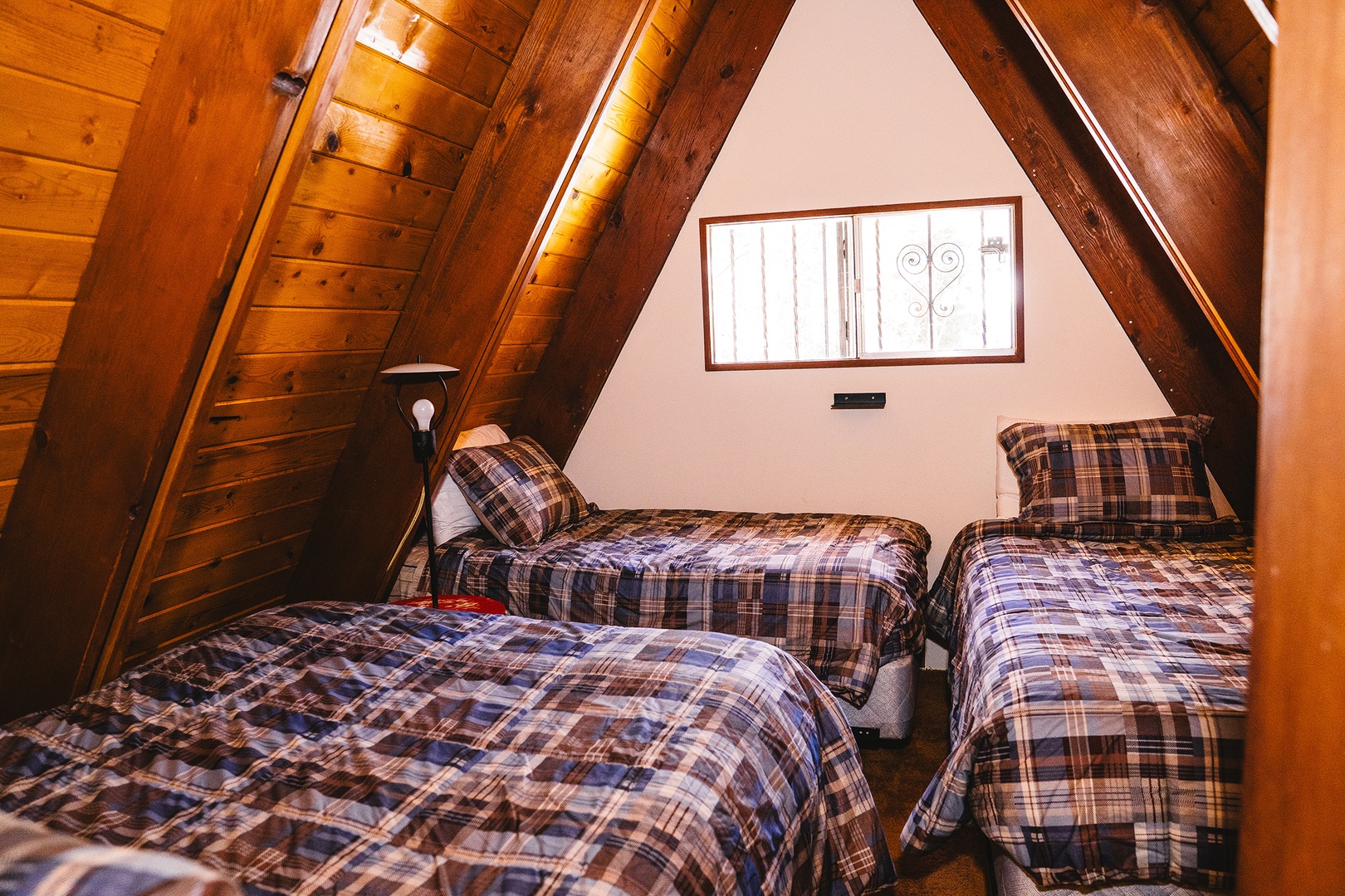 Upstairs bedroom with two twins and a full bed