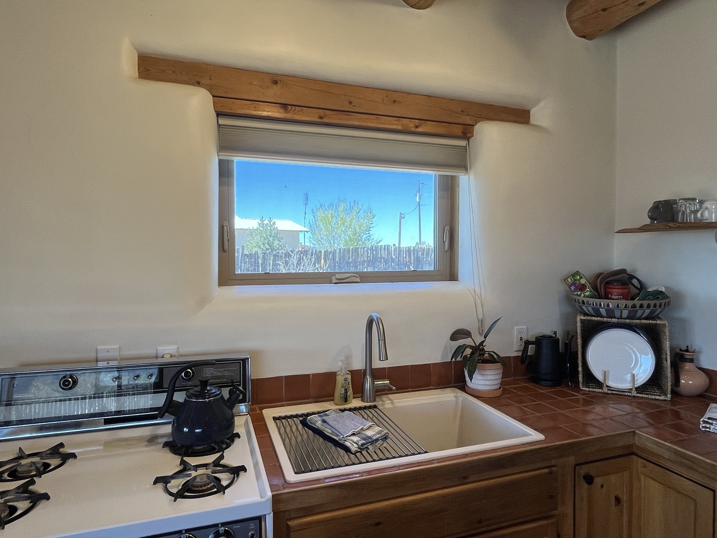Cook with mountain views in your fully equipped kitchen, featuring rustic wood beams and modern appliances for memorable meals.