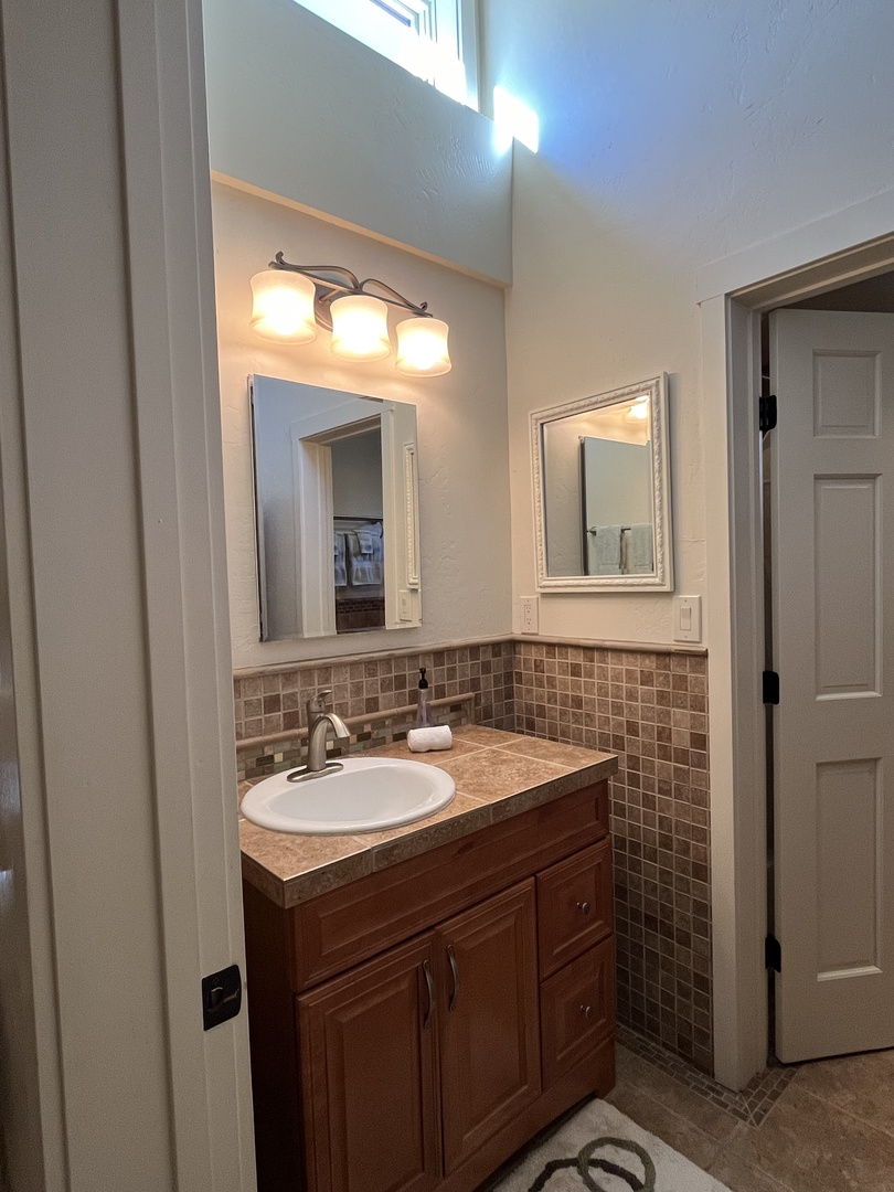 Loft bathroom vanity and storage area