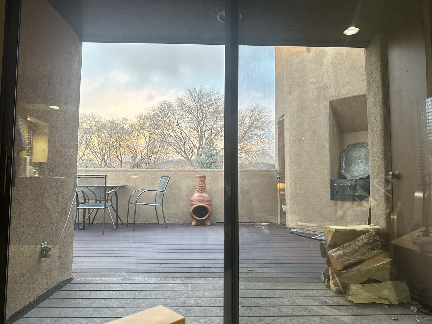 Step onto your private terrace where morning coffee meets breathtaking views, complete with outdoor seating and a cozy fireplace for perfect evenings.