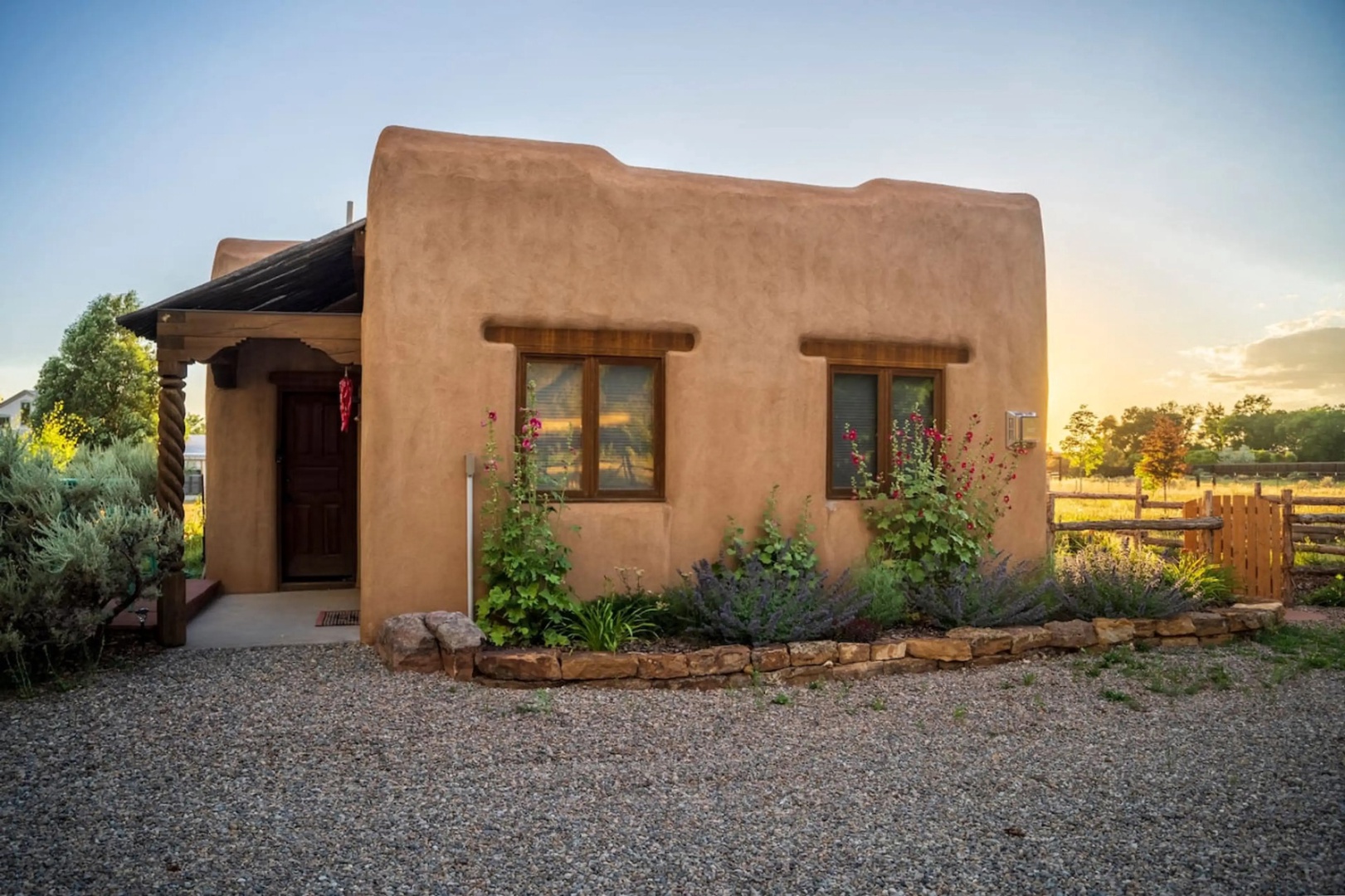 Adobe-style retreat framed by gardens and pastures, with charming Southwest details and peaceful countryside surroundings welcoming guests to this unique getaway.