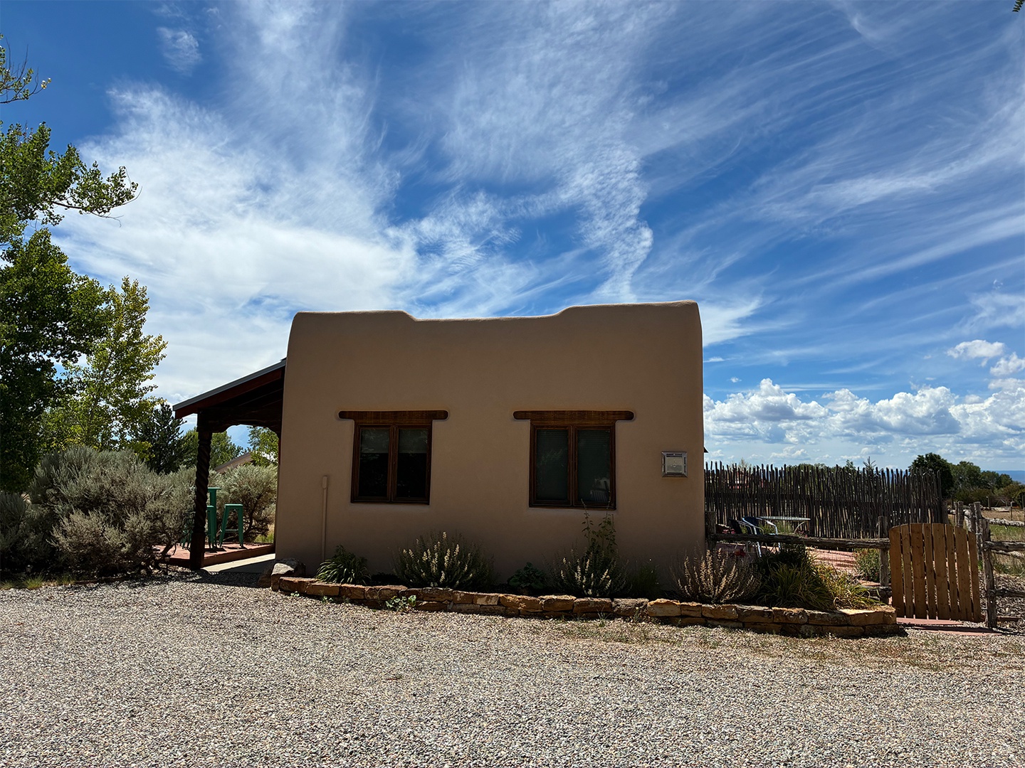 Adobe-style property nestled in a peaceful desert setting, surrounded by natural landscaping and open skies—your private Southwest escape awaits.