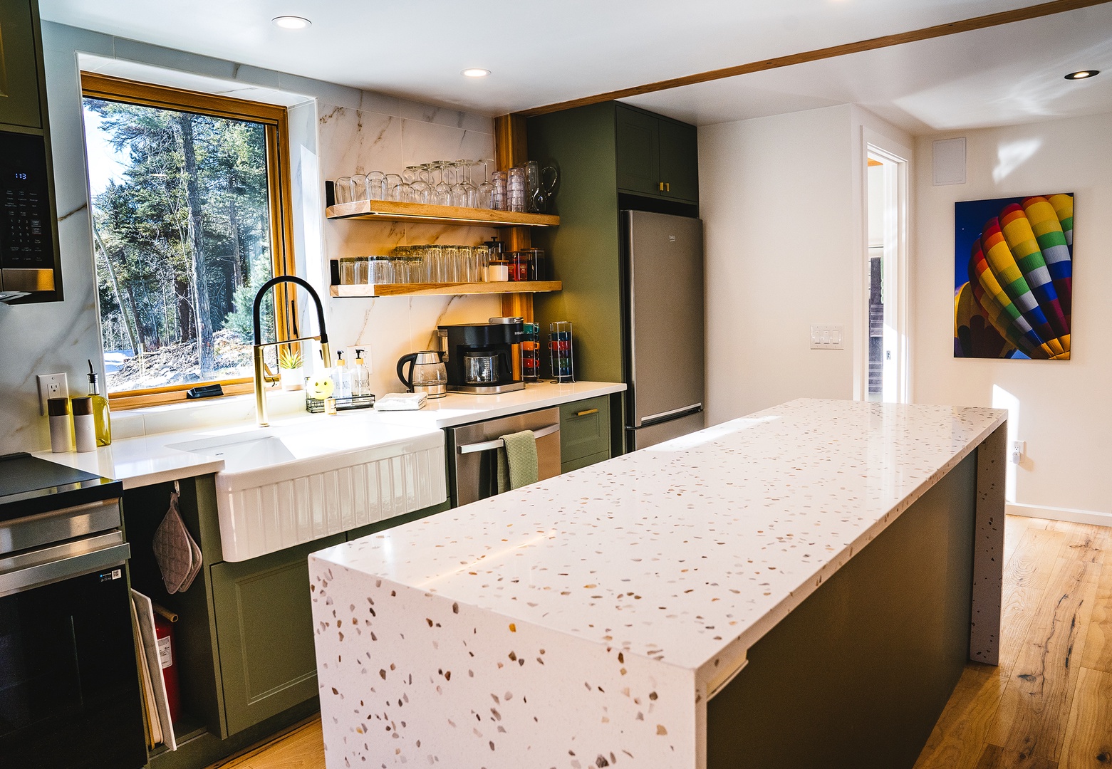 Delicious meals happen in this clean well stocked kitchen space