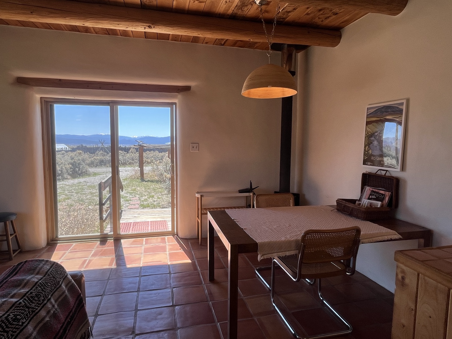 Dine surrounded by rustic charm with exposed wooden beams overhead and breathtaking desert views stretching beyond your table.