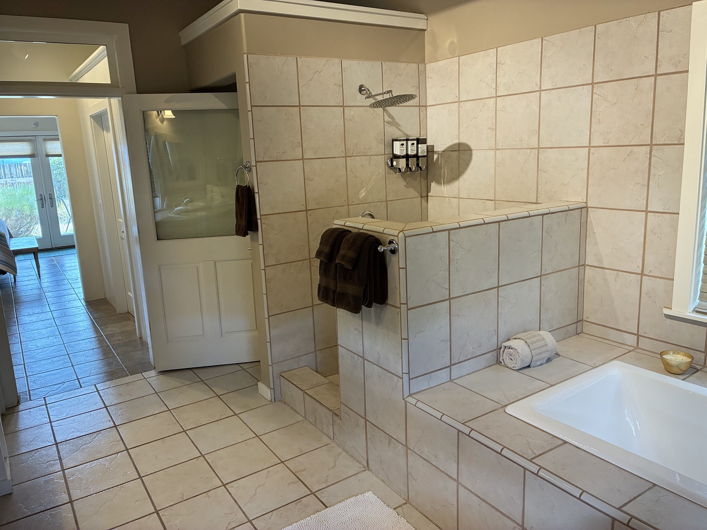 Unwind in your spacious bathroom with a tiled walk-in shower and deep soaking tub—perfect for washing away the day's adventures.