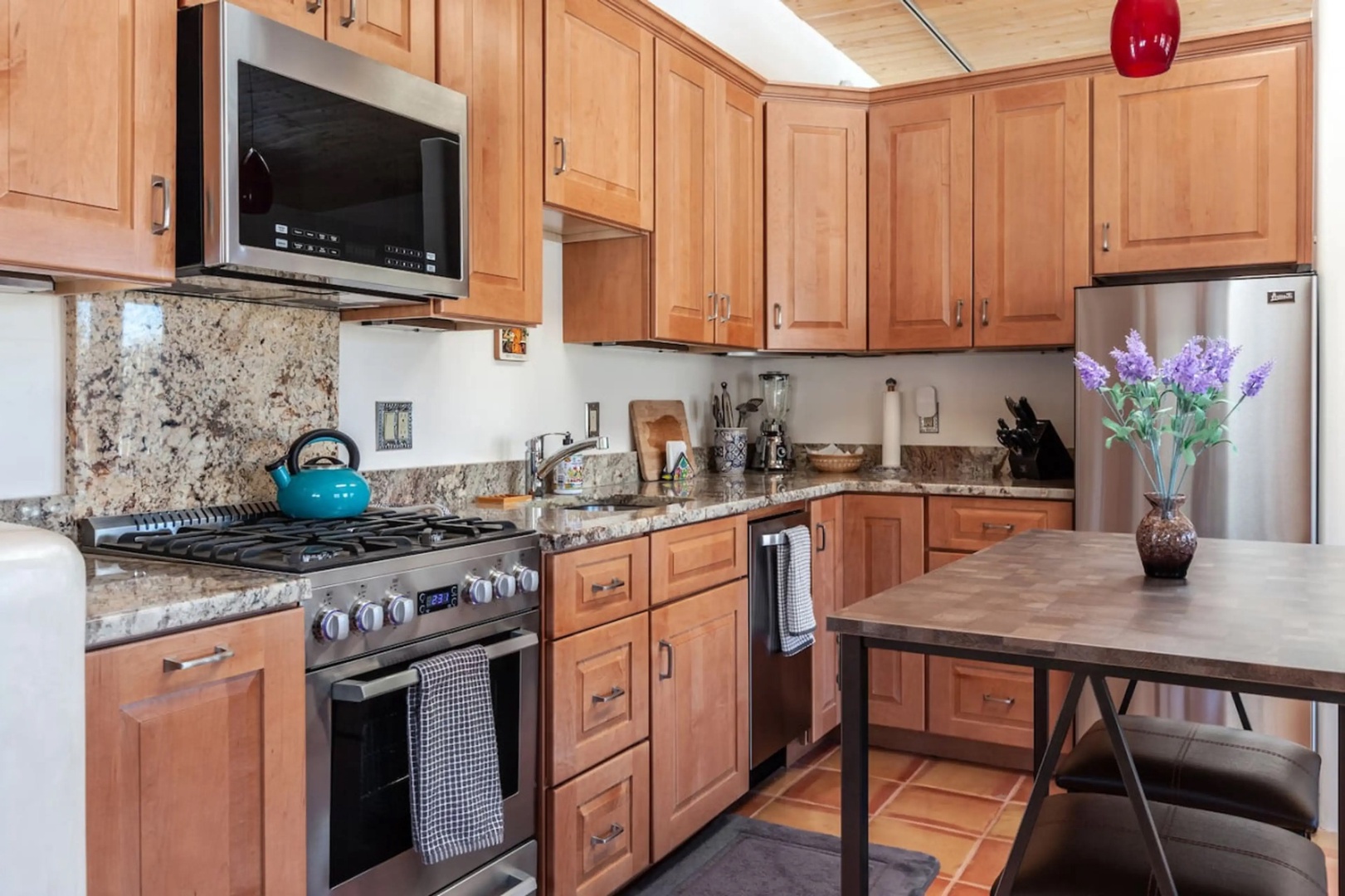 Step into your fully equipped kitchen with stainless appliances, gas range, and granite counters—everything you need to whip up a delicious meal during your stay.