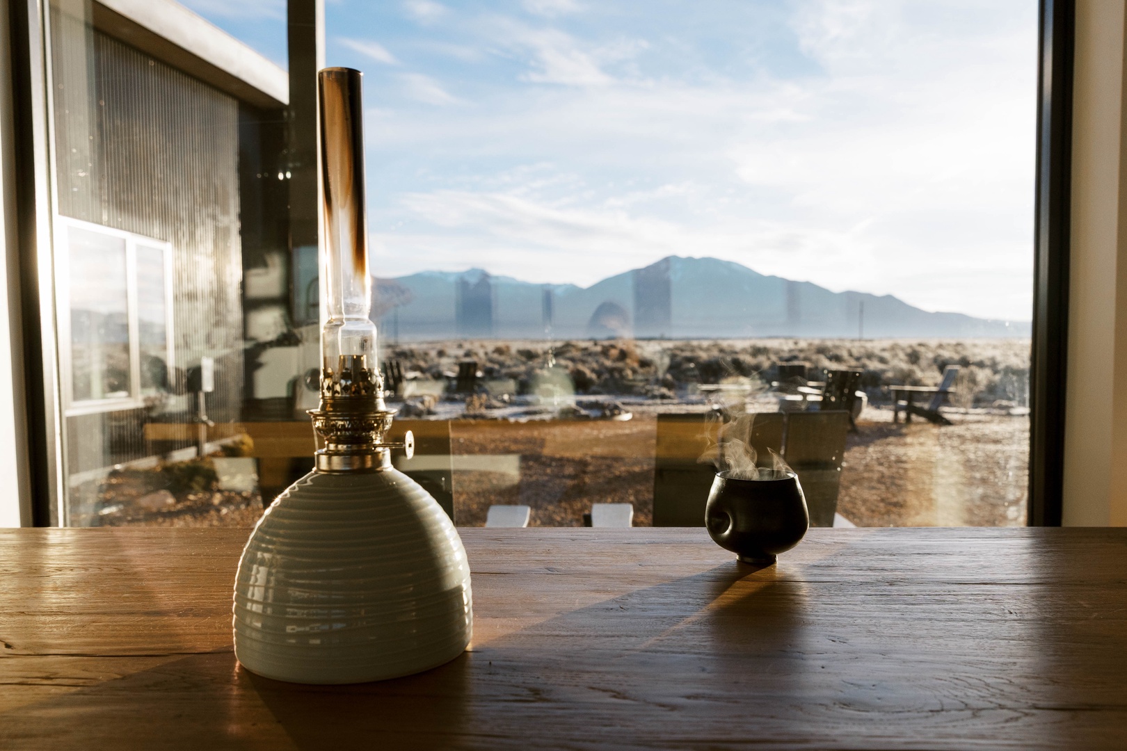 Artistic view of home details and the Sangre de Cristo mountains beyond the picture window