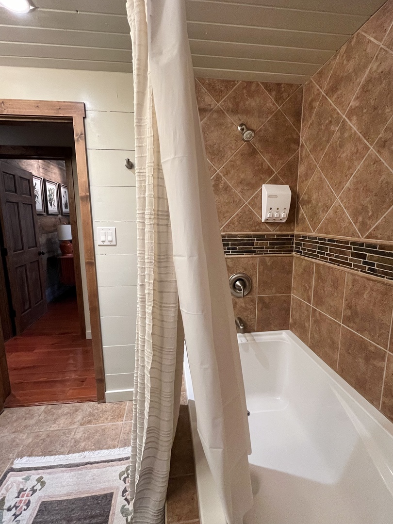 Upstairs queen bathroom tub shower combo
