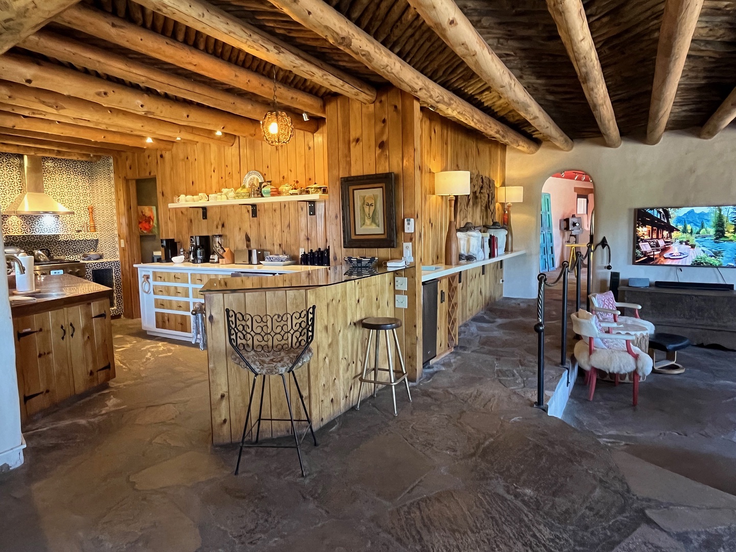 Beautifully appointed kitchen and bar areas just next to the living area and dining area.