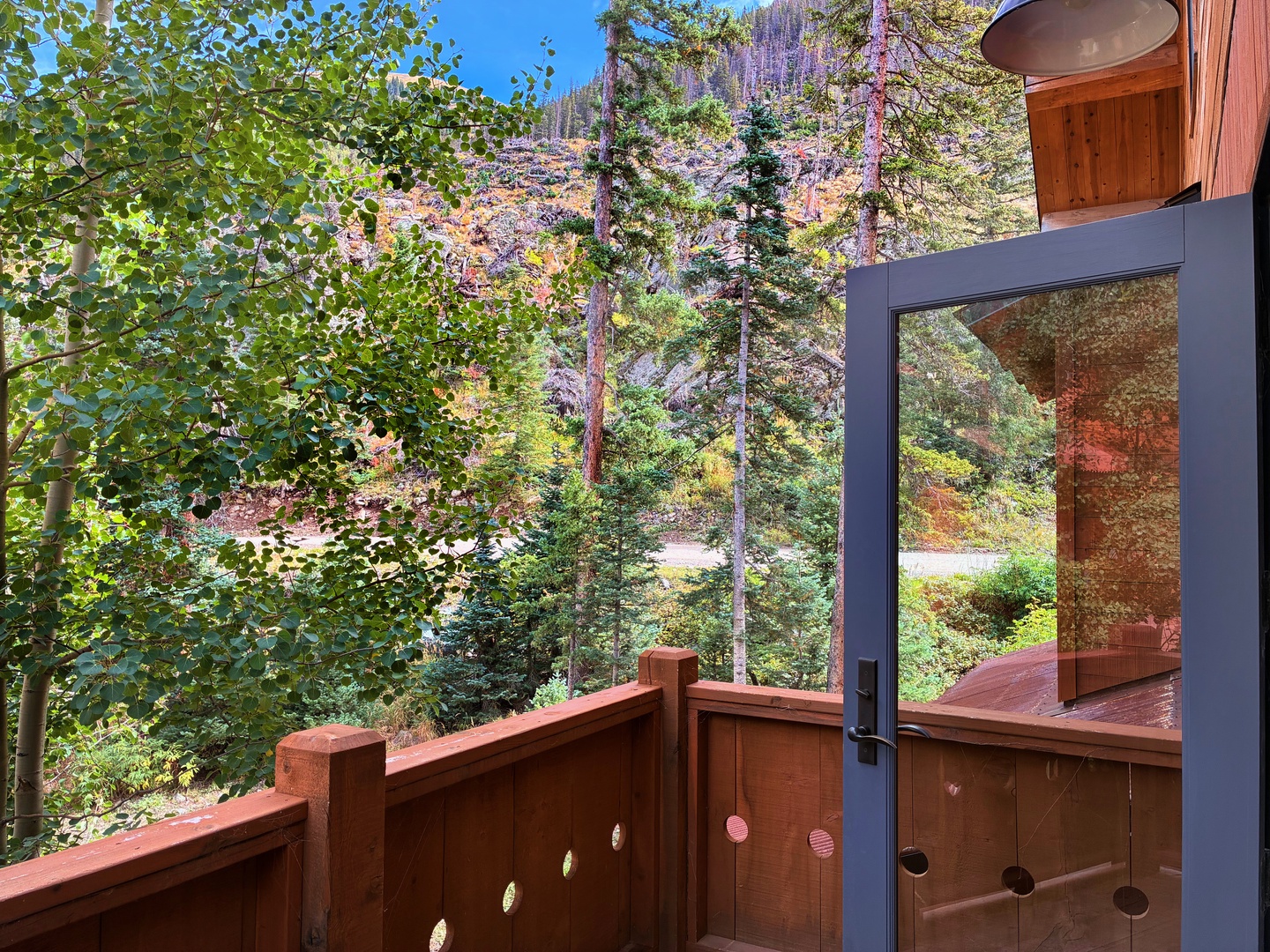 Step onto your private balcony and breathe in crisp mountain air. Towering pines frame stunning fall foliage, while peaceful trails wind just beyond your retreat.