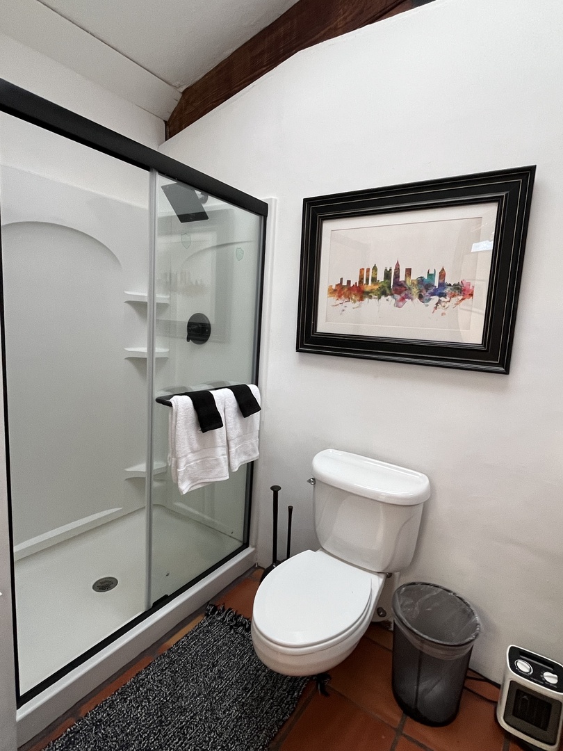 Private ensuite bath with shower, toilet, vanity