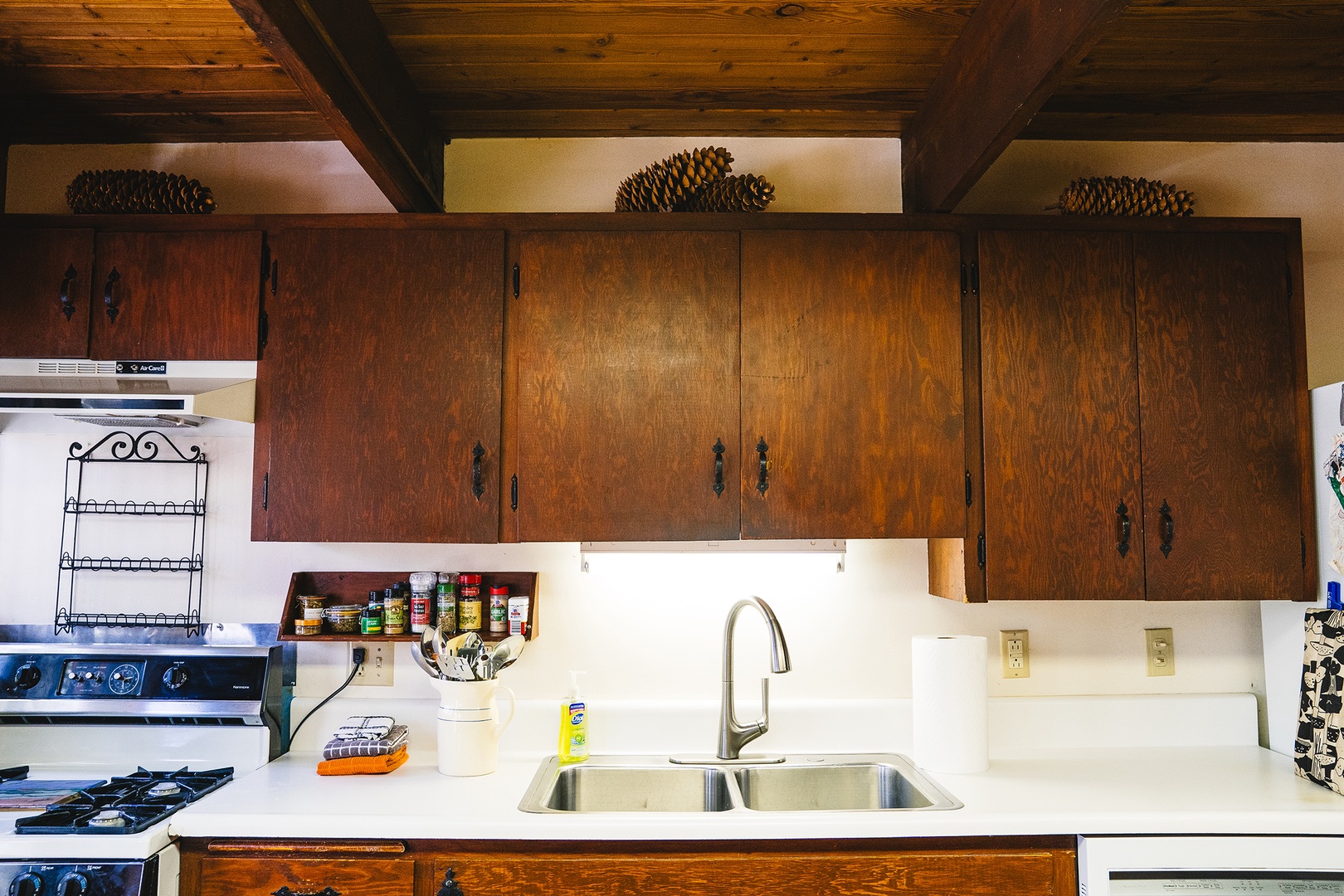 Your fully equipped kitchen features rich wood cabinets, modern appliances, and everything you need to create memorable meals during your stay.