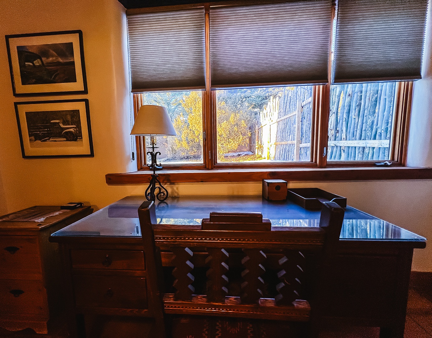 Your private workspace awaits with handcrafted wooden desk, warm lighting, and peaceful garden views to inspire your most productive moments.