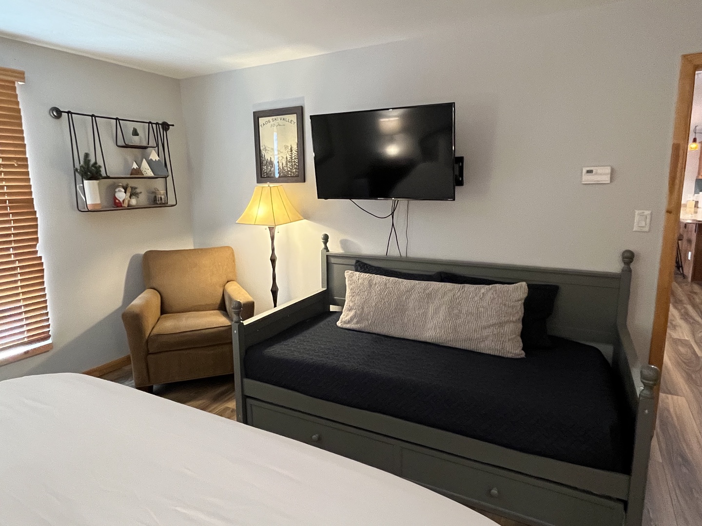 Day bed with trundle twin offers more sleeping space for families in the primary suite.