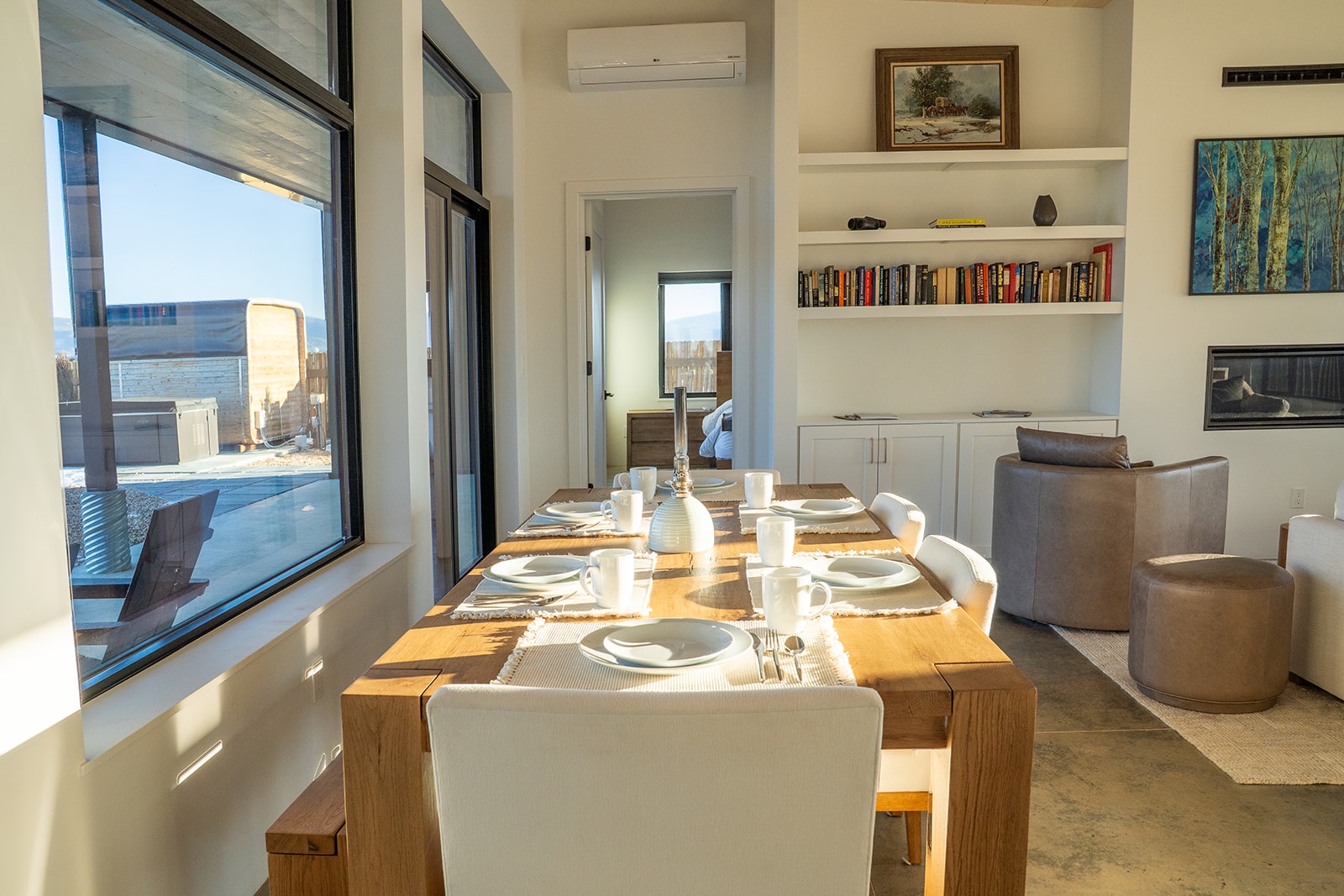 Gather around your elegant dining table for memorable meals while city views frame every conversation through floor-to-ceiling windows.