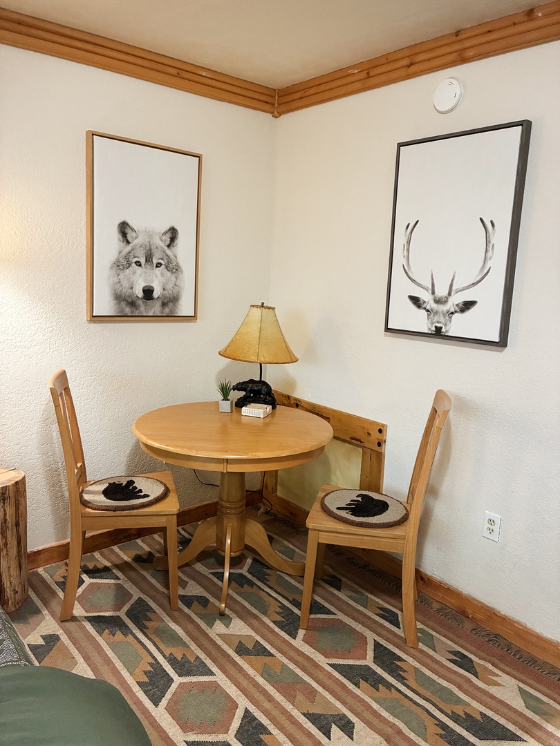 Corner cafe table in the bedroom great for fitting in an hour of work while on vacation