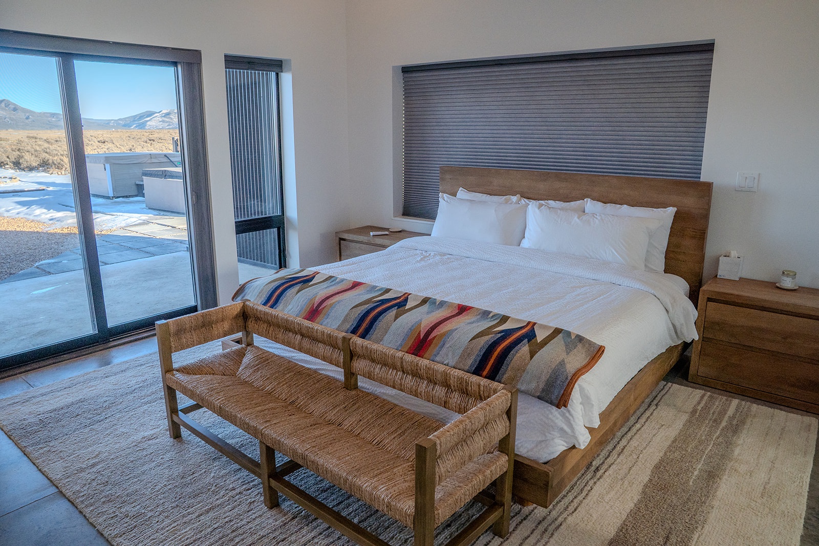 Sink into crisp white linens while enjoying stunning mountain views from your private bedroom retreat.