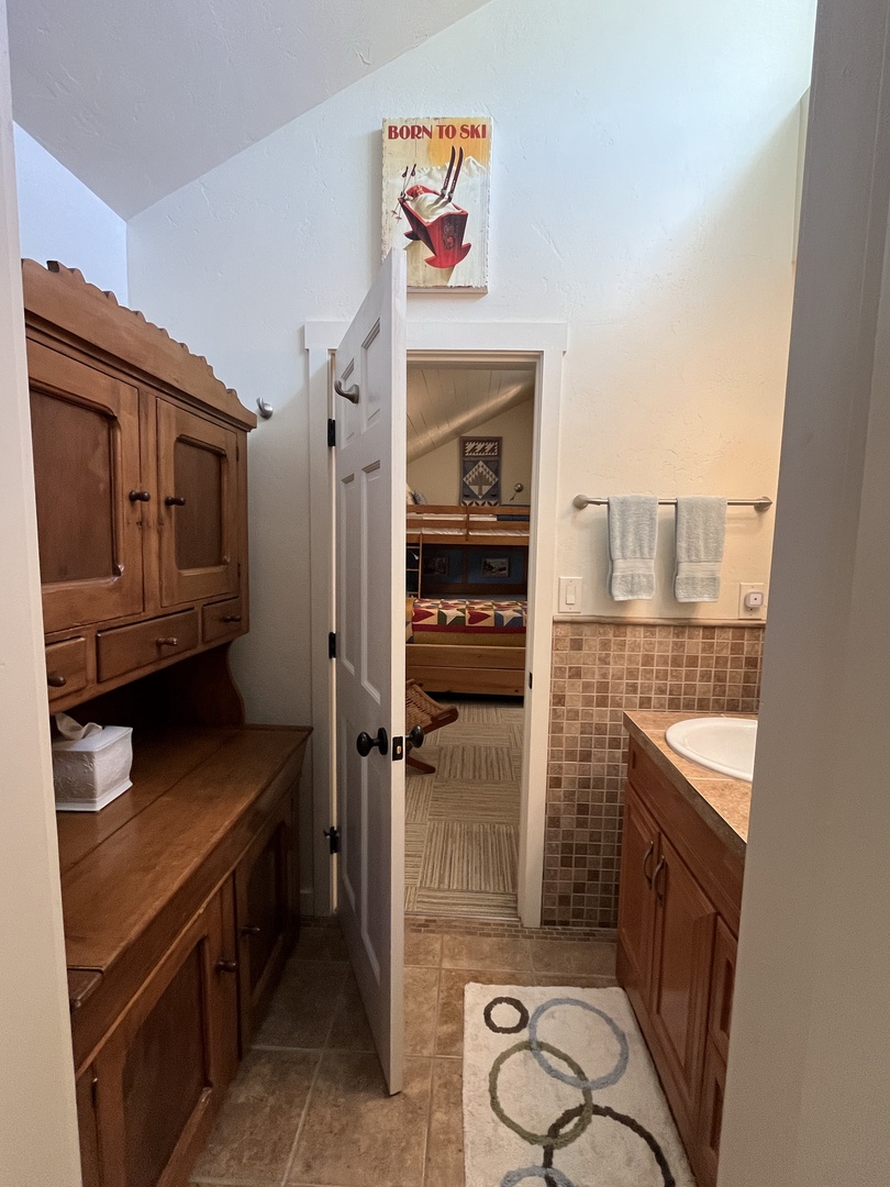 Loft bathroom vanity and storage area