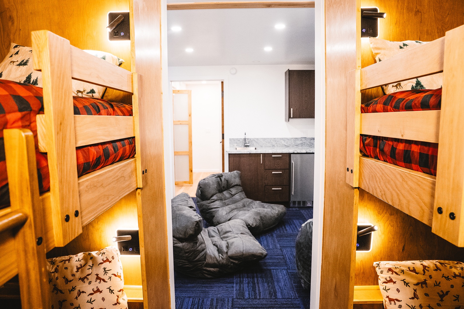 Bunk room looking into media area