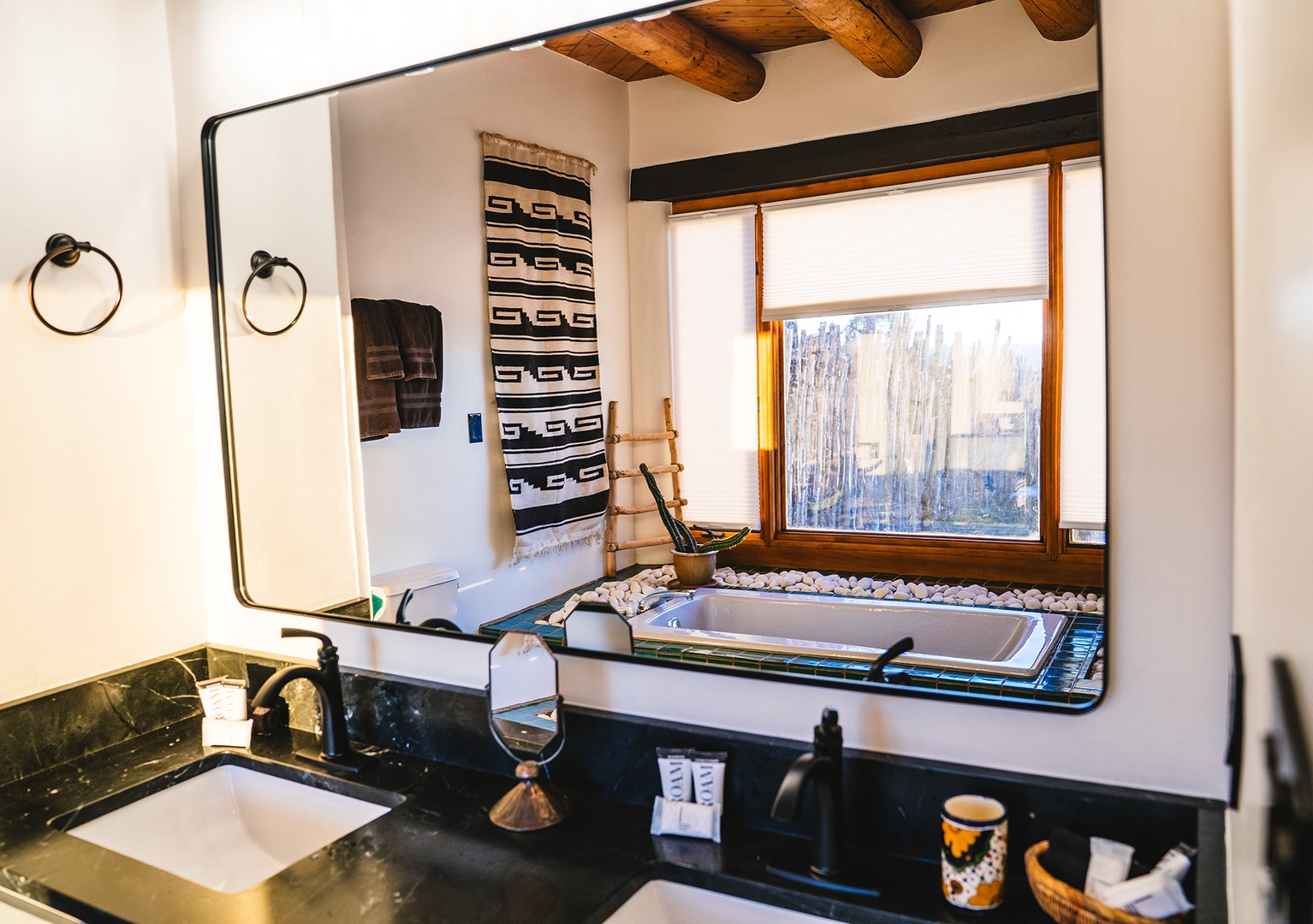Soak in your deep tub while admiring exposed wooden beams and authentic textiles that create a perfect blend of rustic charm and modern comfort.