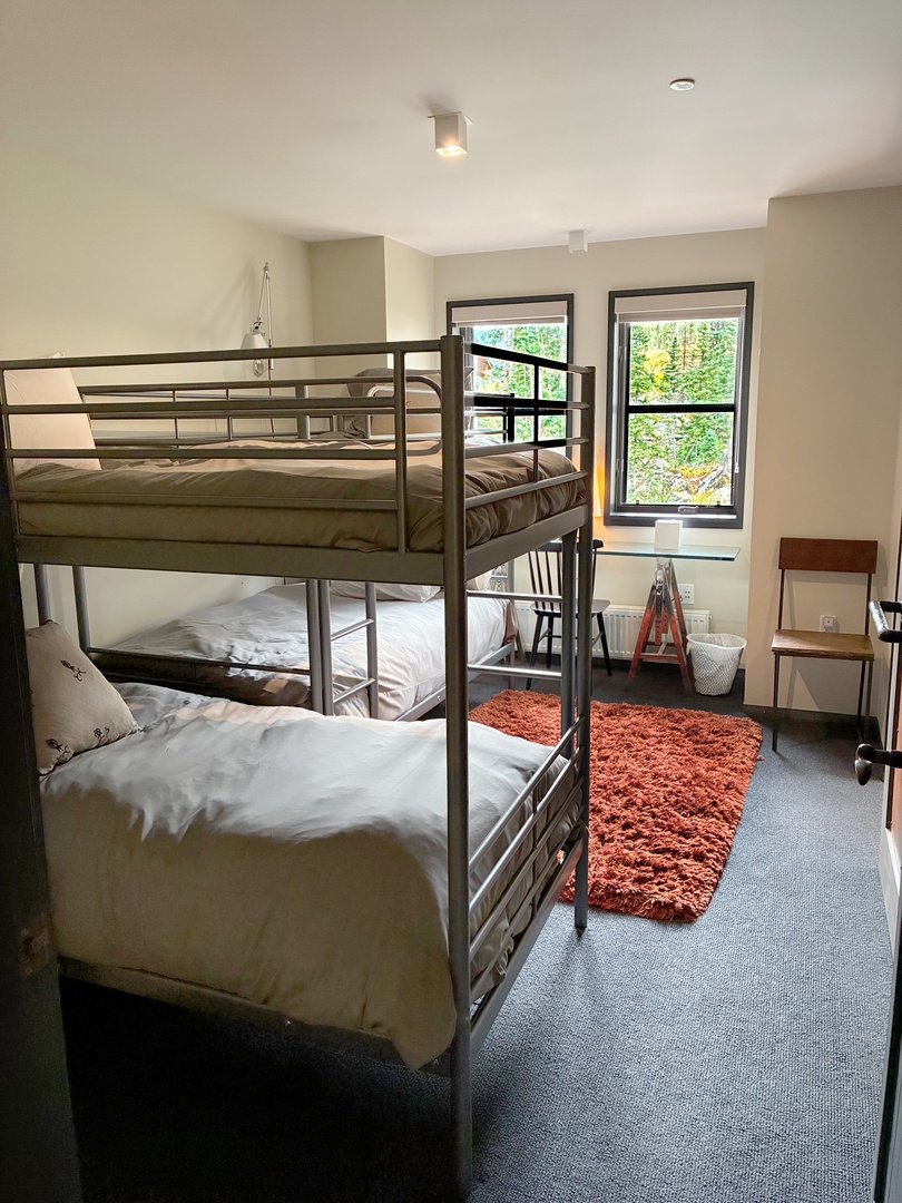 Your kids will love calling dibs on their favorite bunk in this fun, light-filled room with two sturdy bunk beds and garden views that make bedtime a little less like bedtime.