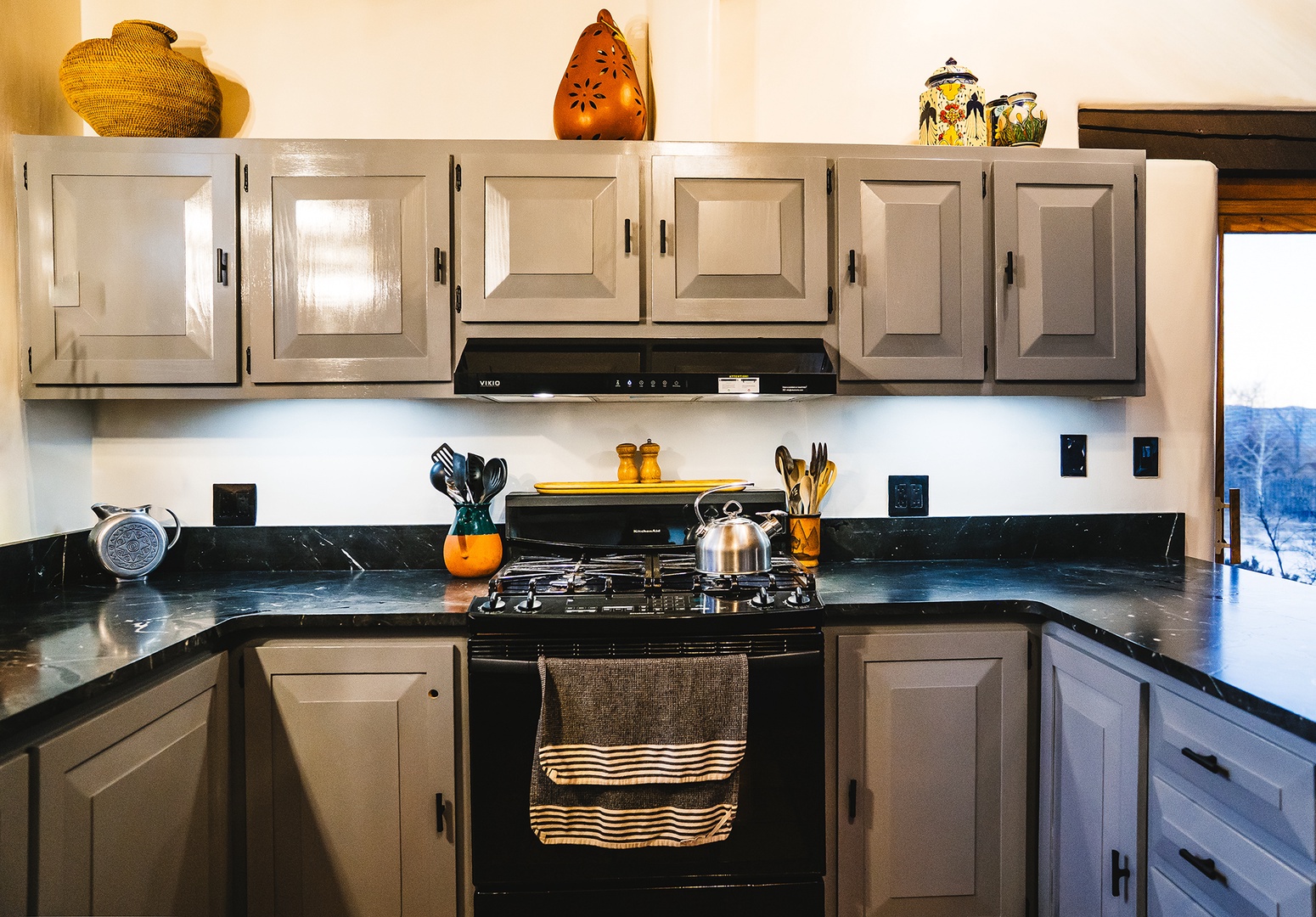 Your fully equipped kitchen invites culinary adventures with sleek granite counters, gas stove, and charming southwestern touches throughout.