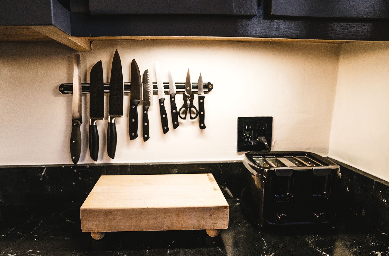 Your fully equipped kitchen features premium knives and a gas stovetop, ready for your culinary adventures.