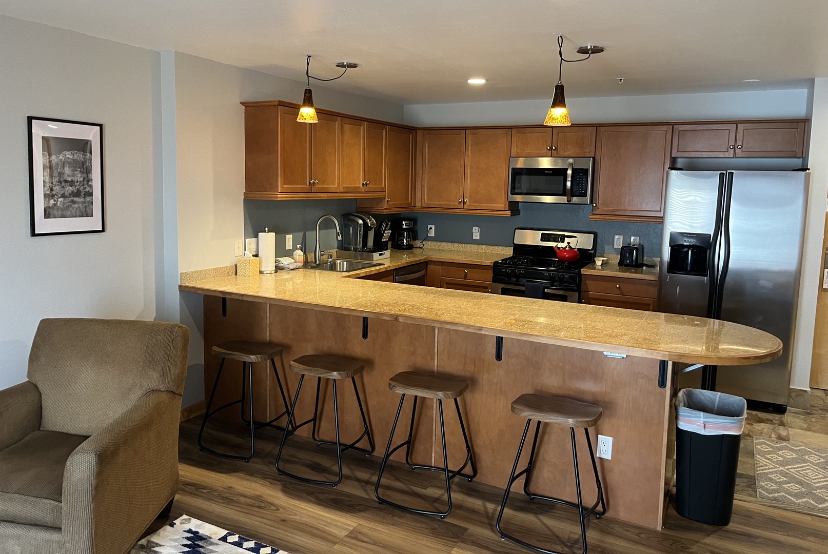 Kitchen with full size appliances, keurig and drip coffee maker and breakfast bar