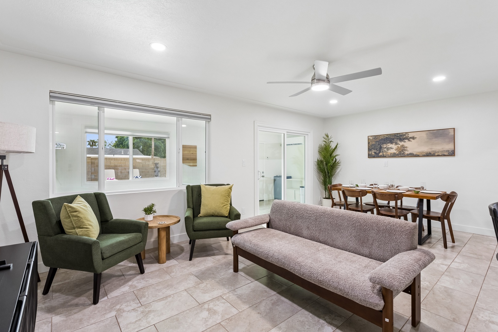 Settle into your stylish living space, where modern comfort meets relaxed elegance. Natural light fills the room, highlighting the clean design and inviting seating perfect for gathering with loved ones.